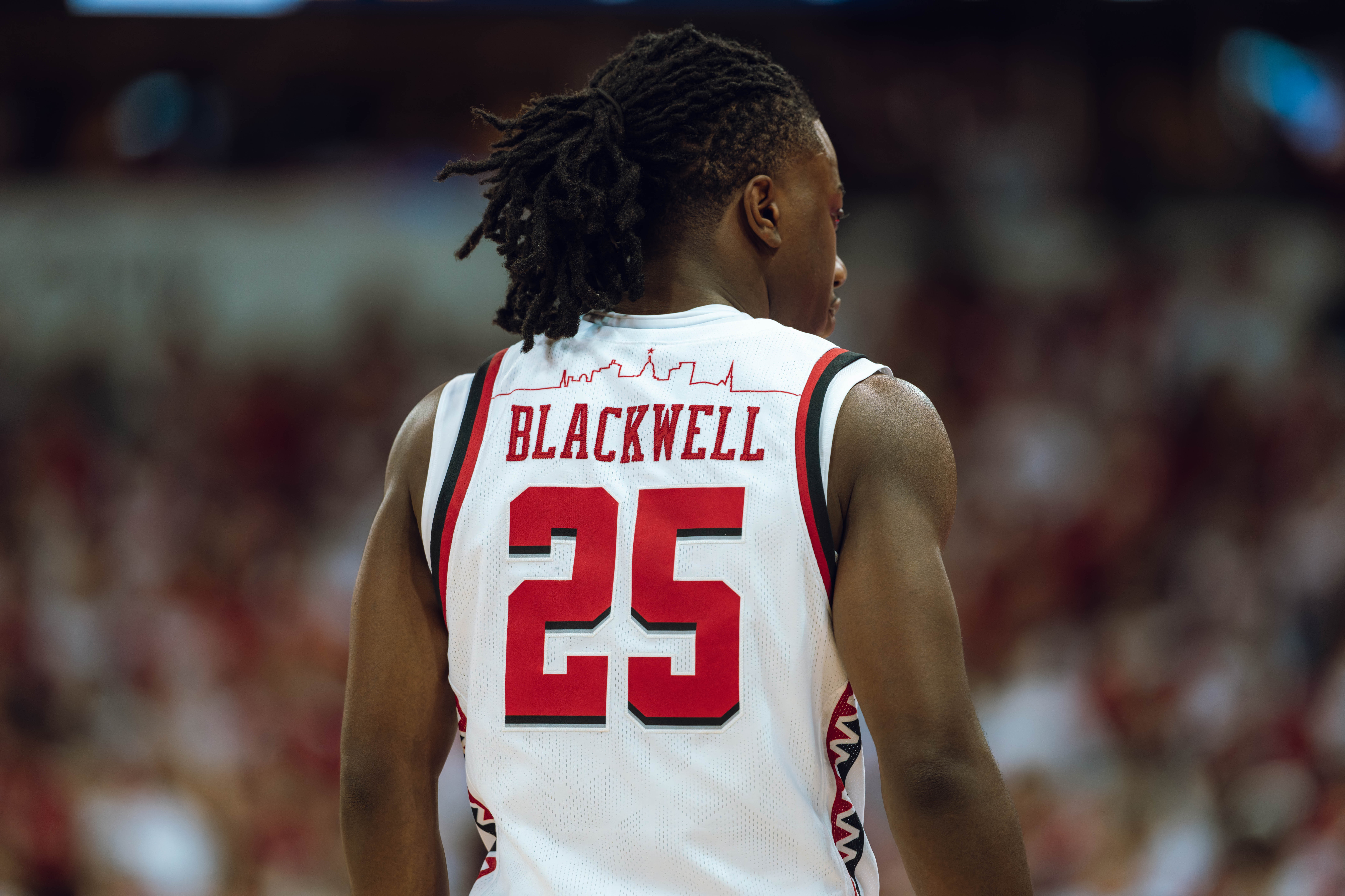 Wisconsin Badgers guard John Blackwell #25 falls back to play defense against the Michigan Wolverines at the Kohl Center on December 03, 2024 in Madison, Wisconsin. Photography by Ross Harried for Second Crop Sports.