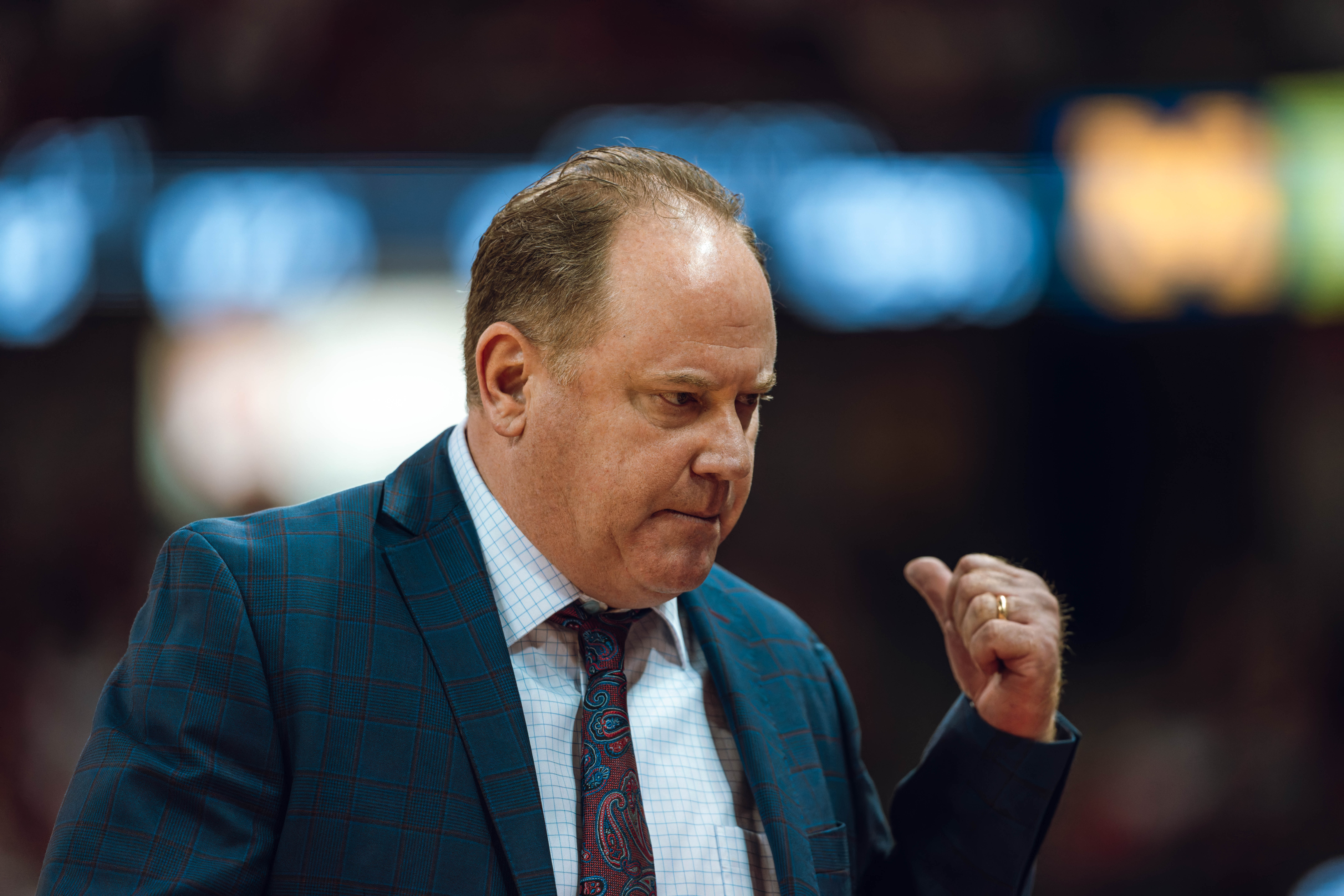 Wisconsin Badgers head coach Greg Gard signals a substitution to the bench against the Michigan Wolverines at the Kohl Center on December 03, 2024 in Madison, Wisconsin. Photography by Ross Harried for Second Crop Sports.