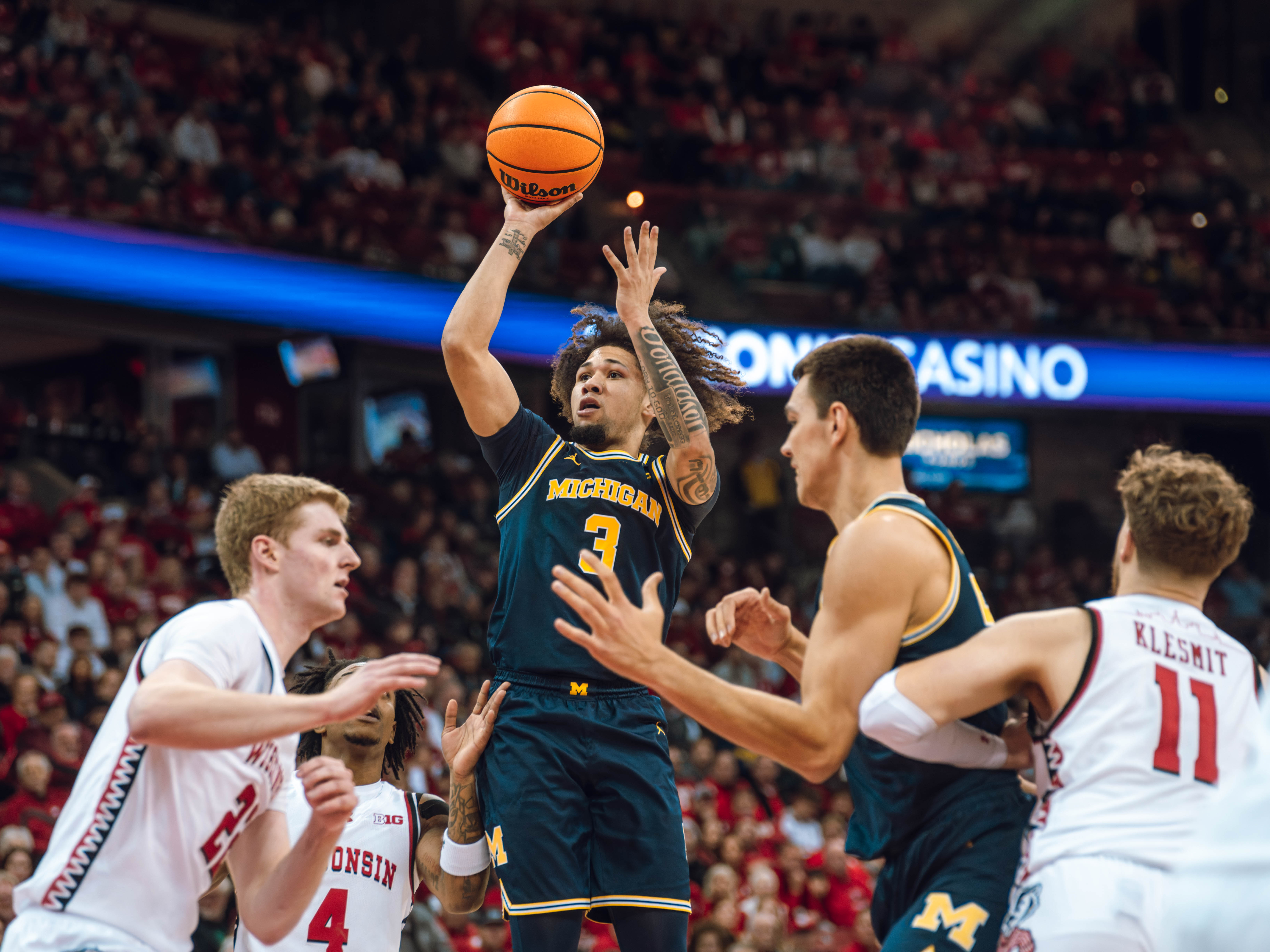 Michigan Wolverines guard Tre Donaldson #3 attempts a shot against the Wisconsin Badgers at the Kohl Center on December 03, 2024 in Madison, Wisconsin. Photography by Ross Harried for Second Crop Sports.