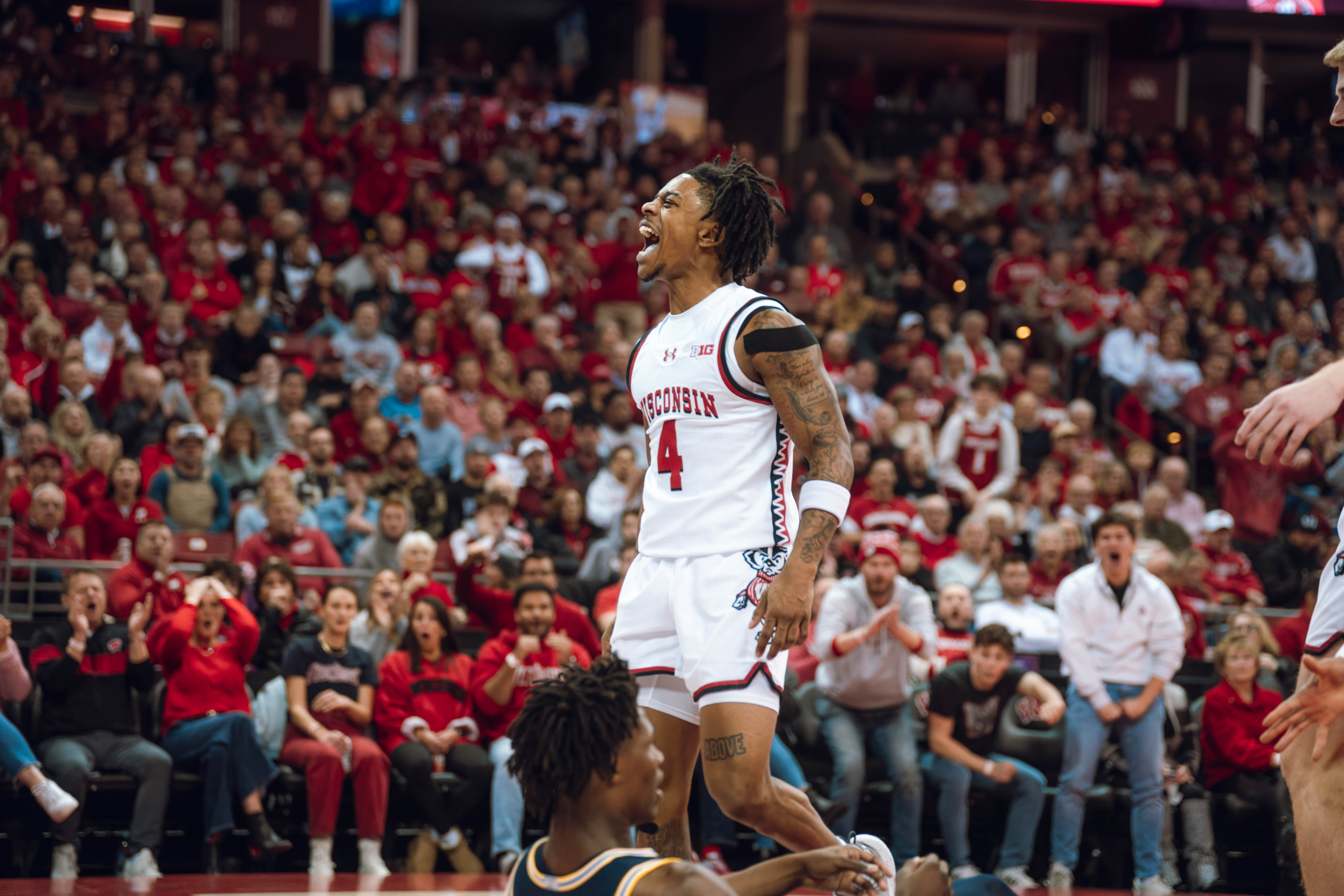 Wisconsin Badgers guard Kamari McGee #4 celebrates drawing a foul against the Michigan Wolverines at the Kohl Center on December 03, 2024 in Madison, Wisconsin. Photography by Ross Harried for Second Crop Sports.