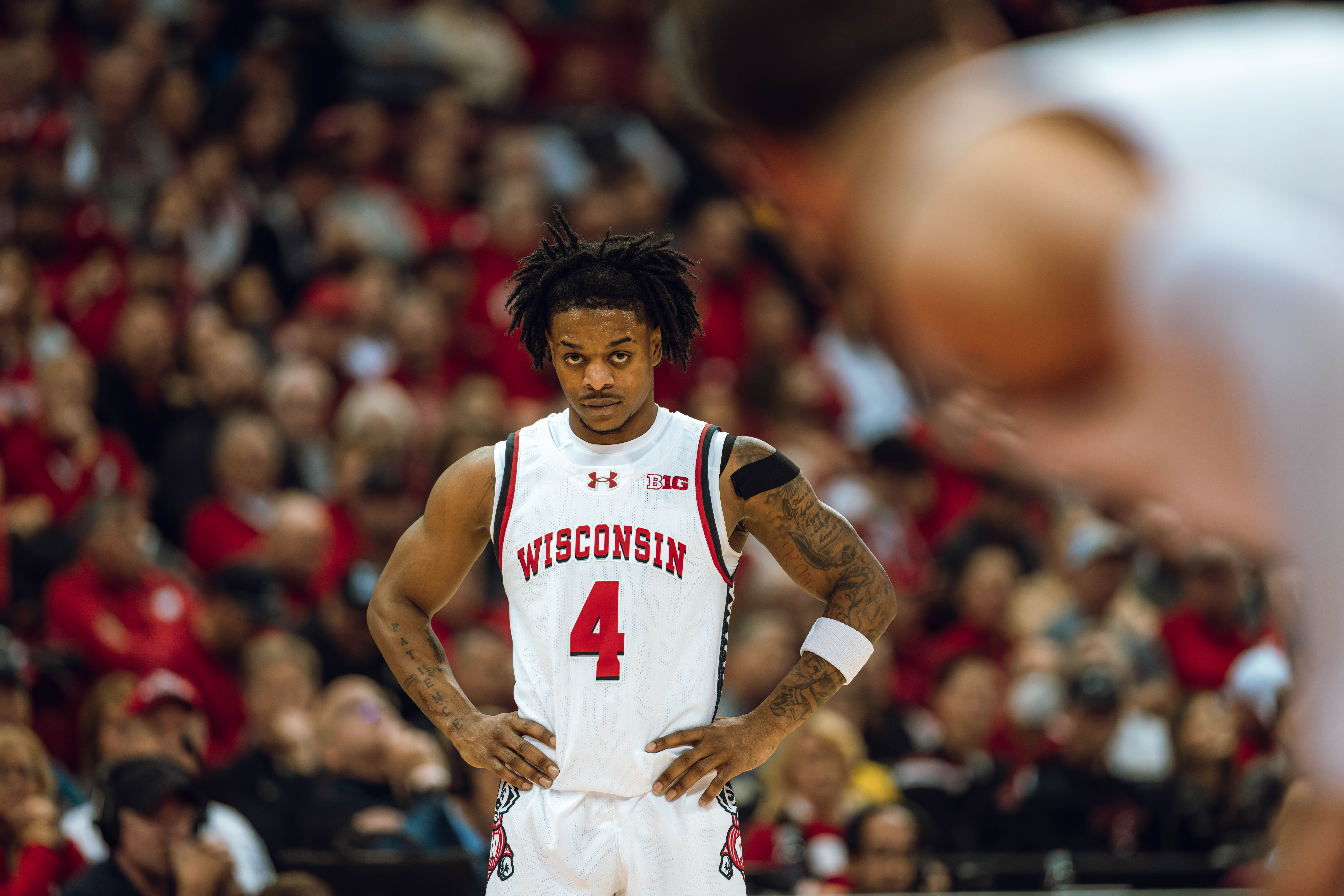 Wisconsin Badgers guard Kamari McGee #4 looks on during a free throw late in the second half against the Michigan Wolverines at the Kohl Center on December 03, 2024 in Madison, Wisconsin. Photography by Ross Harried for Second Crop Sports.