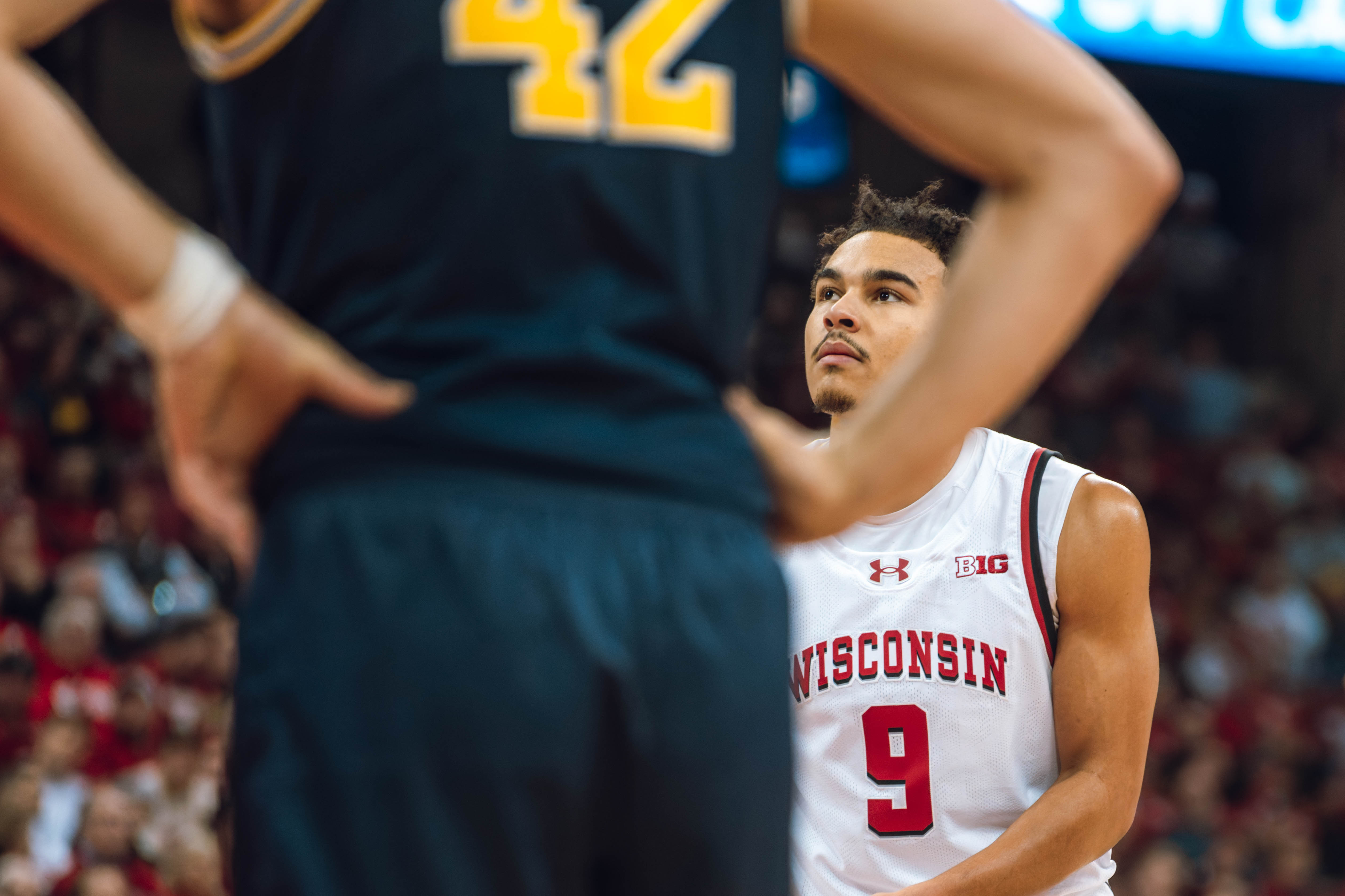 Wisconsin Badgers guard John Tonje #9 eyes the rim before a free throw in the second half against the Michigan Wolverines at the Kohl Center on December 03, 2024 in Madison, Wisconsin. Photography by Ross Harried for Second Crop Sports.