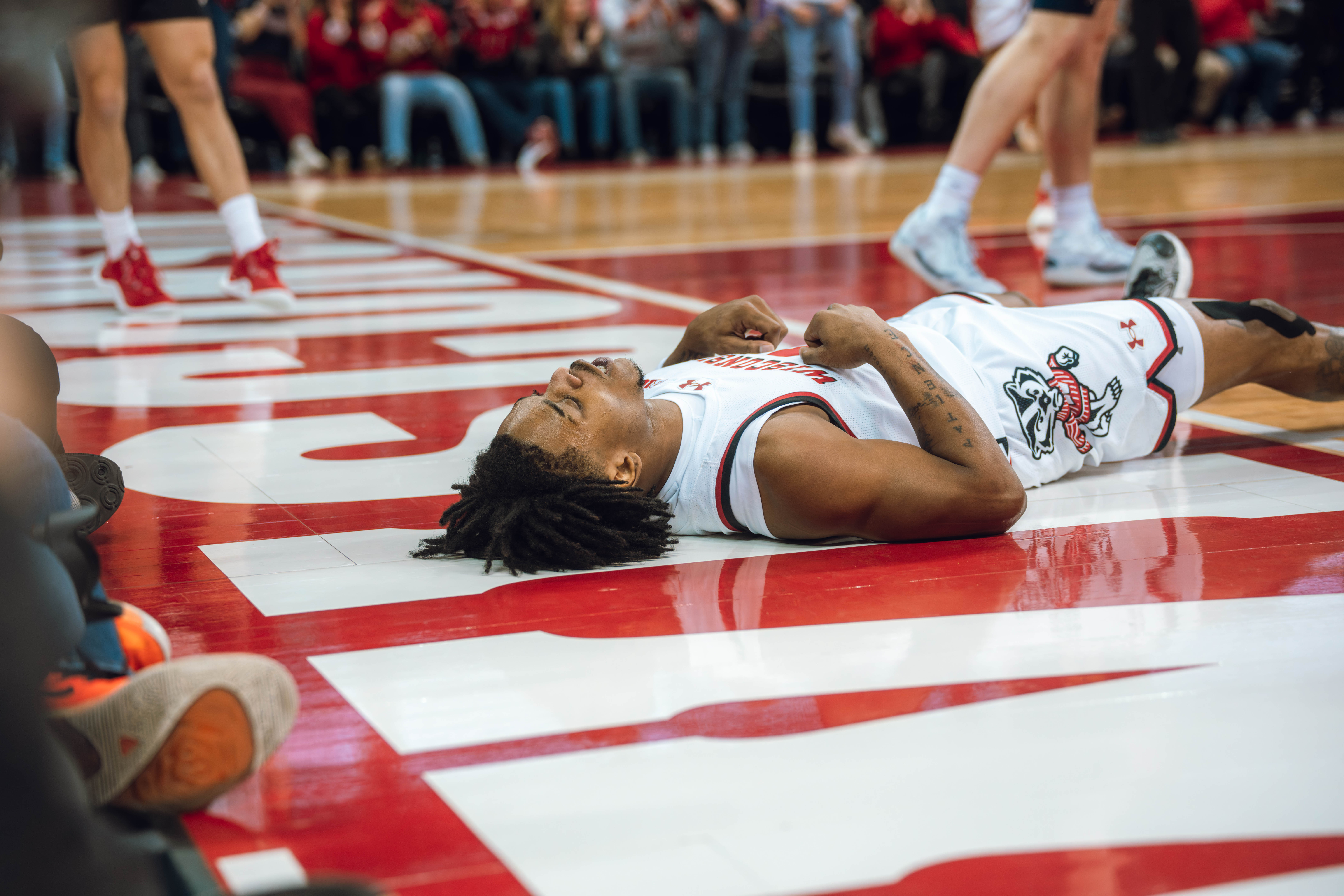 Wisconsin Badgers guard Kamari McGee #4 celebrates an and one opportunity against the Wolverines at the Kohl Center on December 03, 2024 in Madison, Wisconsin. Photography by Ross Harried for Second Crop Sports.