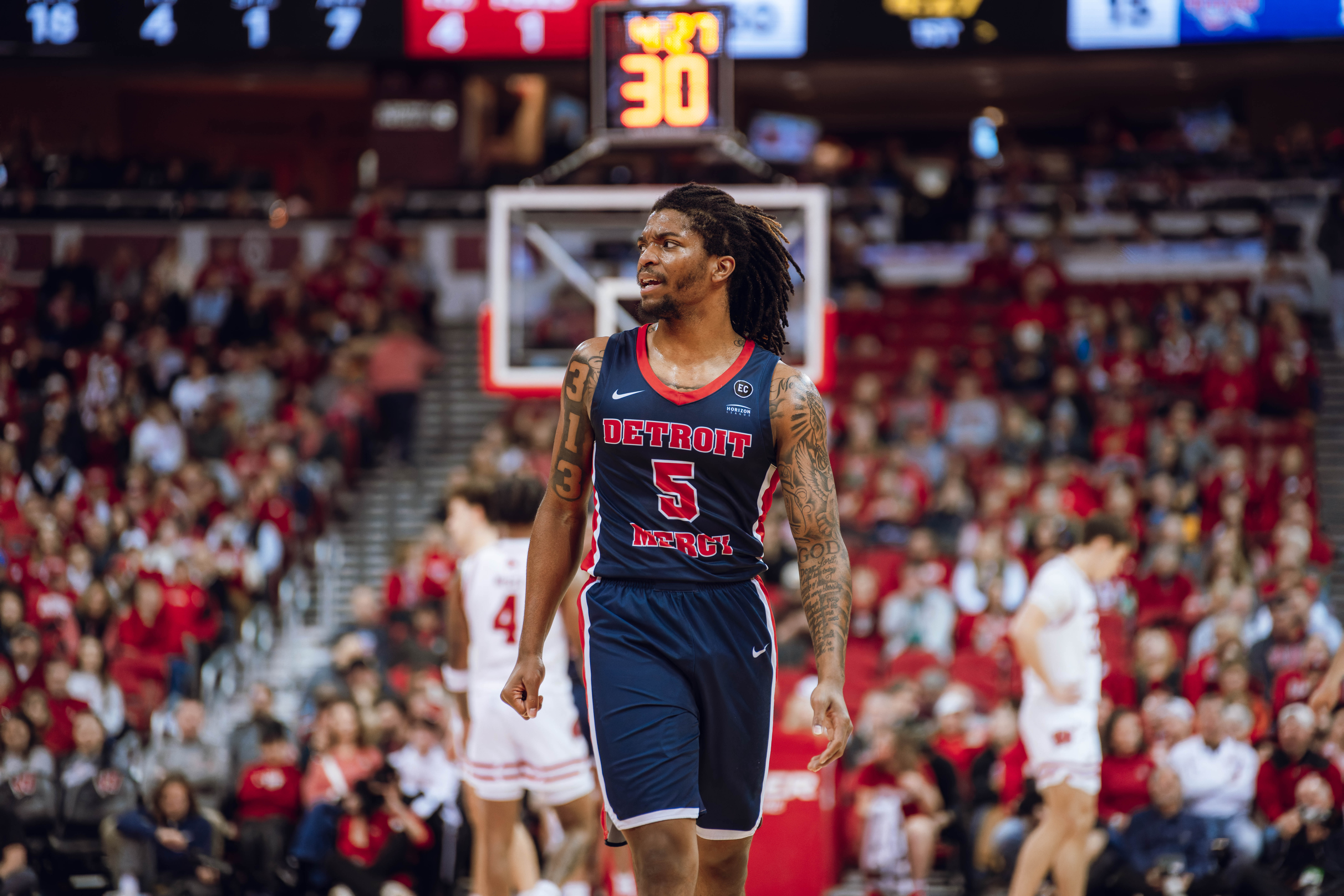 Detroit Mercy Titans guard Orlando Lovejoy #5 looks to the bench in the first half against theWisconsin Badgers at the Kohl Center on December 22, 2024 in Madison, Wisconsin. Photography by Ross Harried for Second Crop Sports.