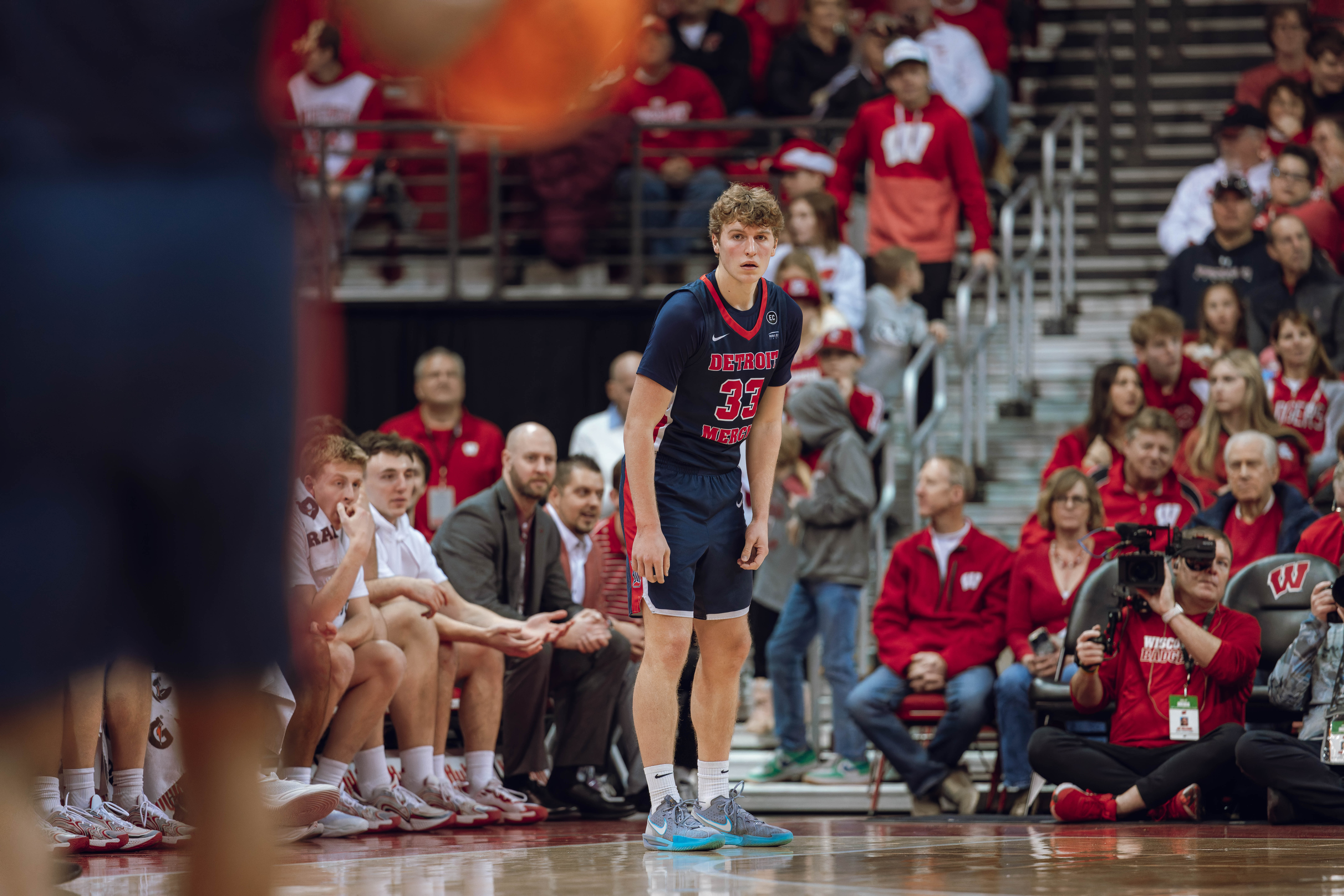 Detroit Mercy Titans guard TJ Nadeau #33 watches as the ball is brought up court against the Wisconsin Badgers at Kohl Center on December 22, 2024 in Madison, Wisconsin. Photography by Ross Harried for Second Crop Sports.