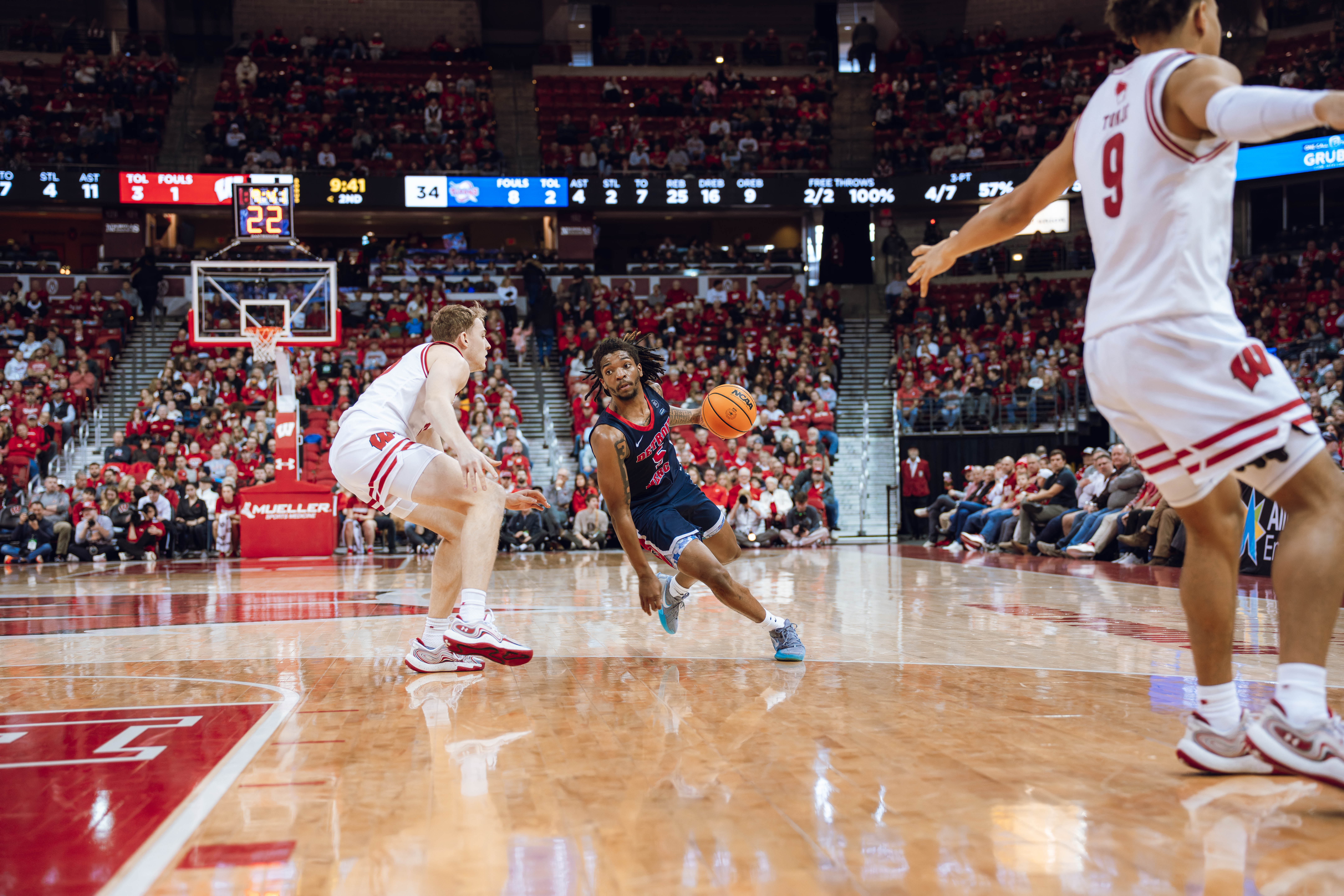 Detroit Mercy Titans guard Orlando Lovejoy #5 drives to the hoop against the Wisconsin Badgers at Kohl Center on December 22, 2024 in Madison, Wisconsin. Photography by Ross Harried for Second Crop Sports.