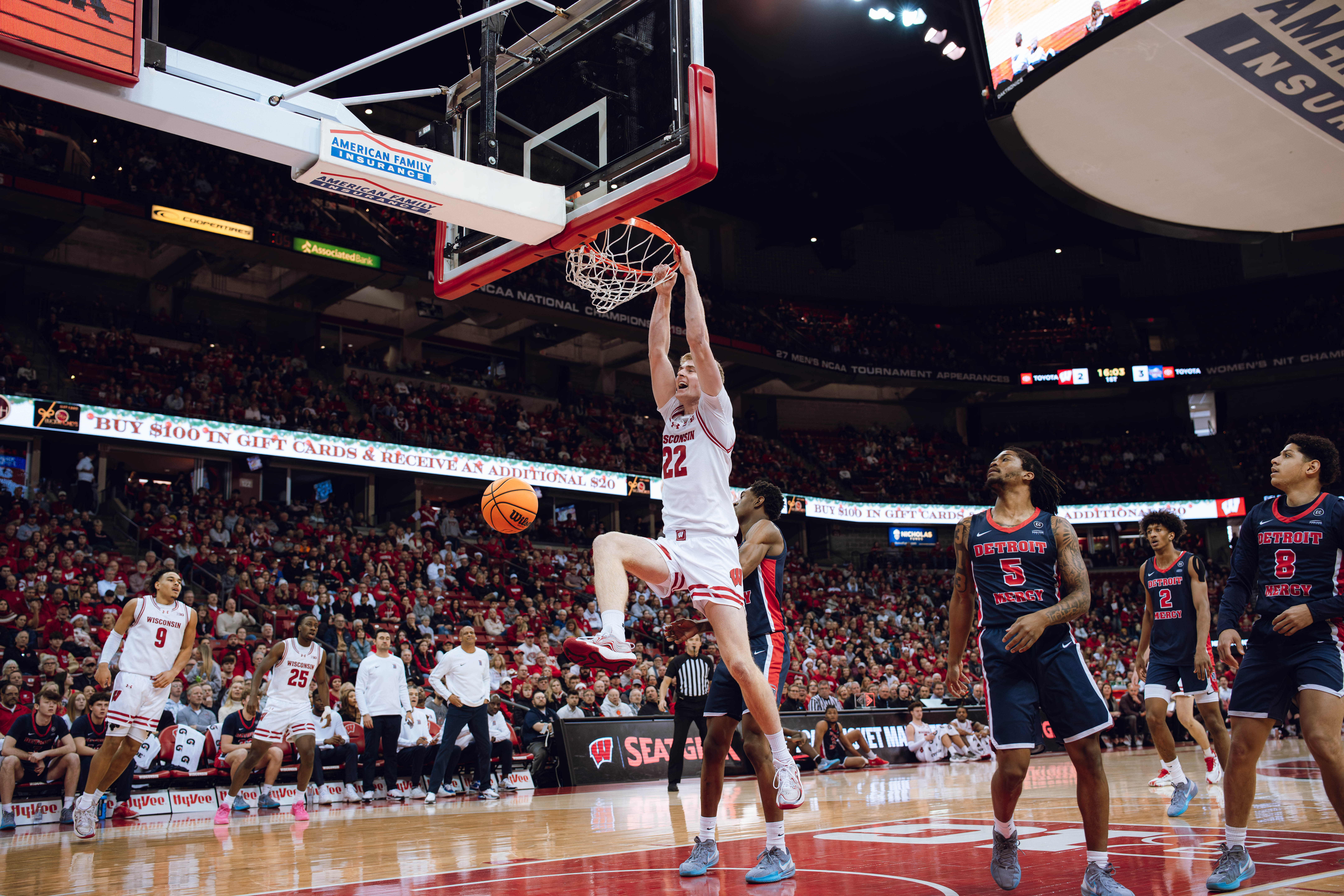 Wisconsin Badgers forward Steven Crowl #22 slams a wide open dunk in the first half against the Detroit Mercy Titans at Kohl Center on December 22, 2024 in Madison, Wisconsin. Photography by Ross Harried for Second Crop Sports.