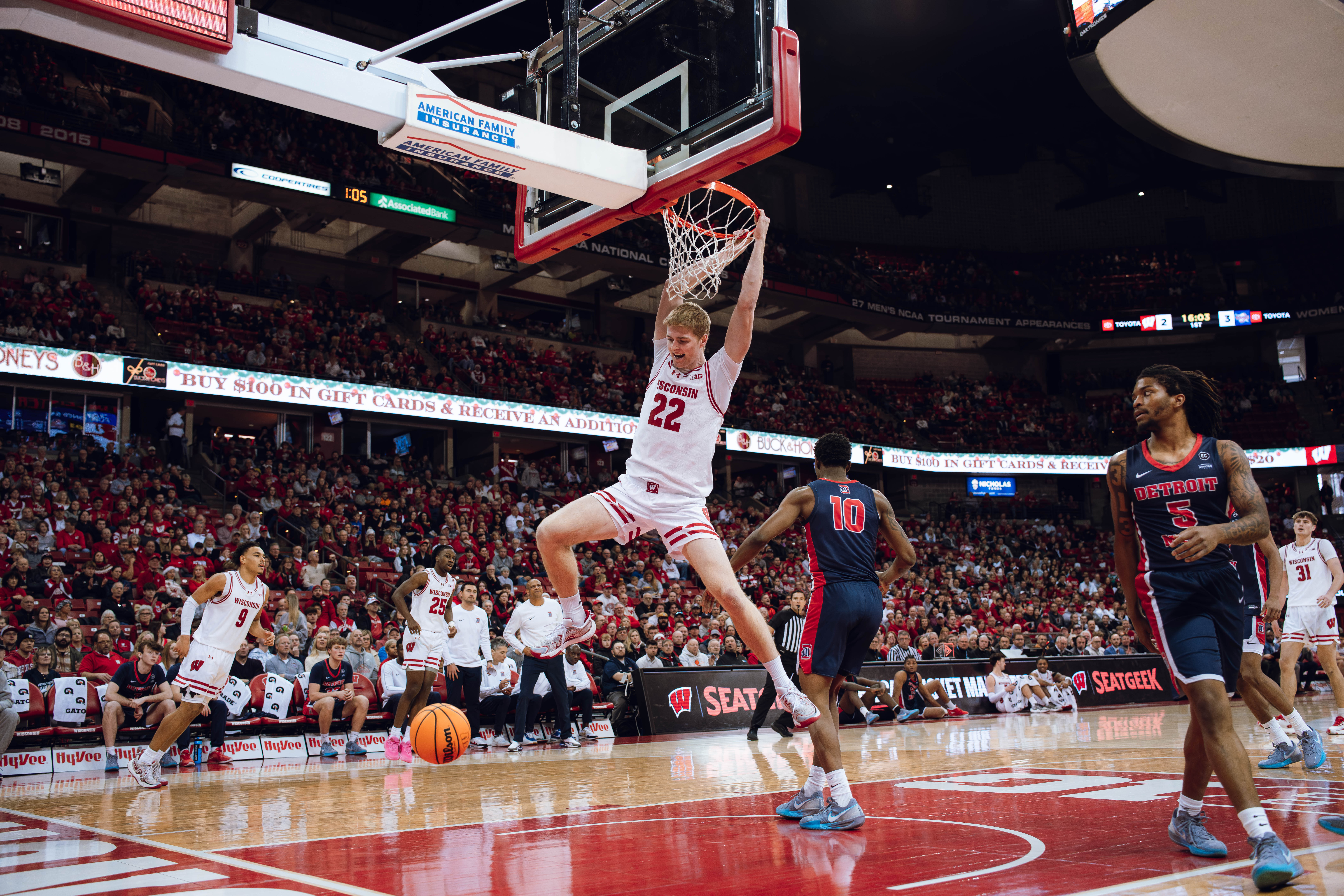 Wisconsin Badgers forward Steven Crowl #22 slams a wide open dunk in the first half against the Detroit Mercy Titans at Kohl Center on December 22, 2024 in Madison, Wisconsin. Photography by Ross Harried for Second Crop Sports.