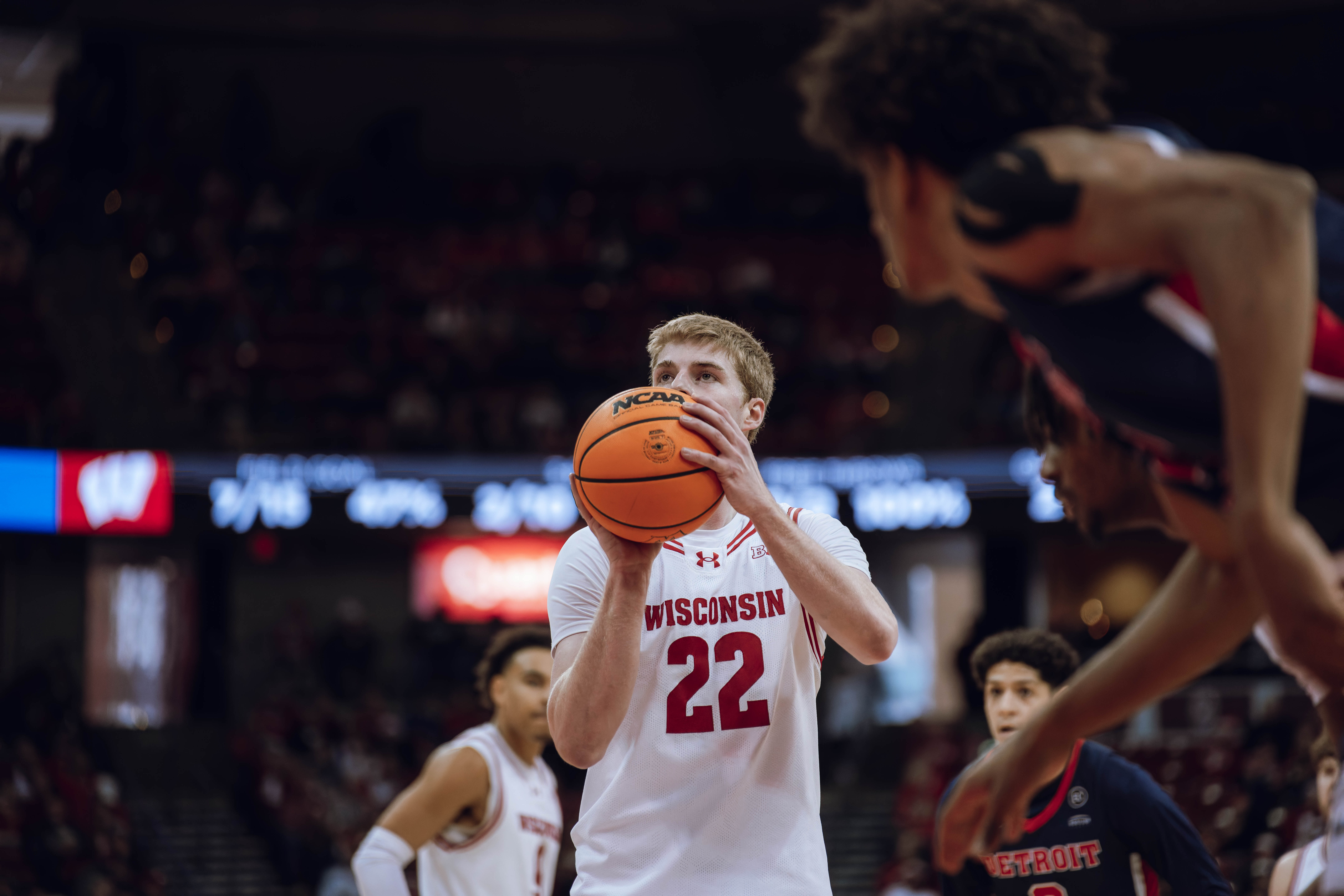 Wisconsin Badgers forward Steven Crowl #22 eyes the rim before a free throw against the Detroit Mercy Titans at Kohl Center on December 22, 2024 in Madison, Wisconsin. Photography by Ross Harried for Second Crop Sports.