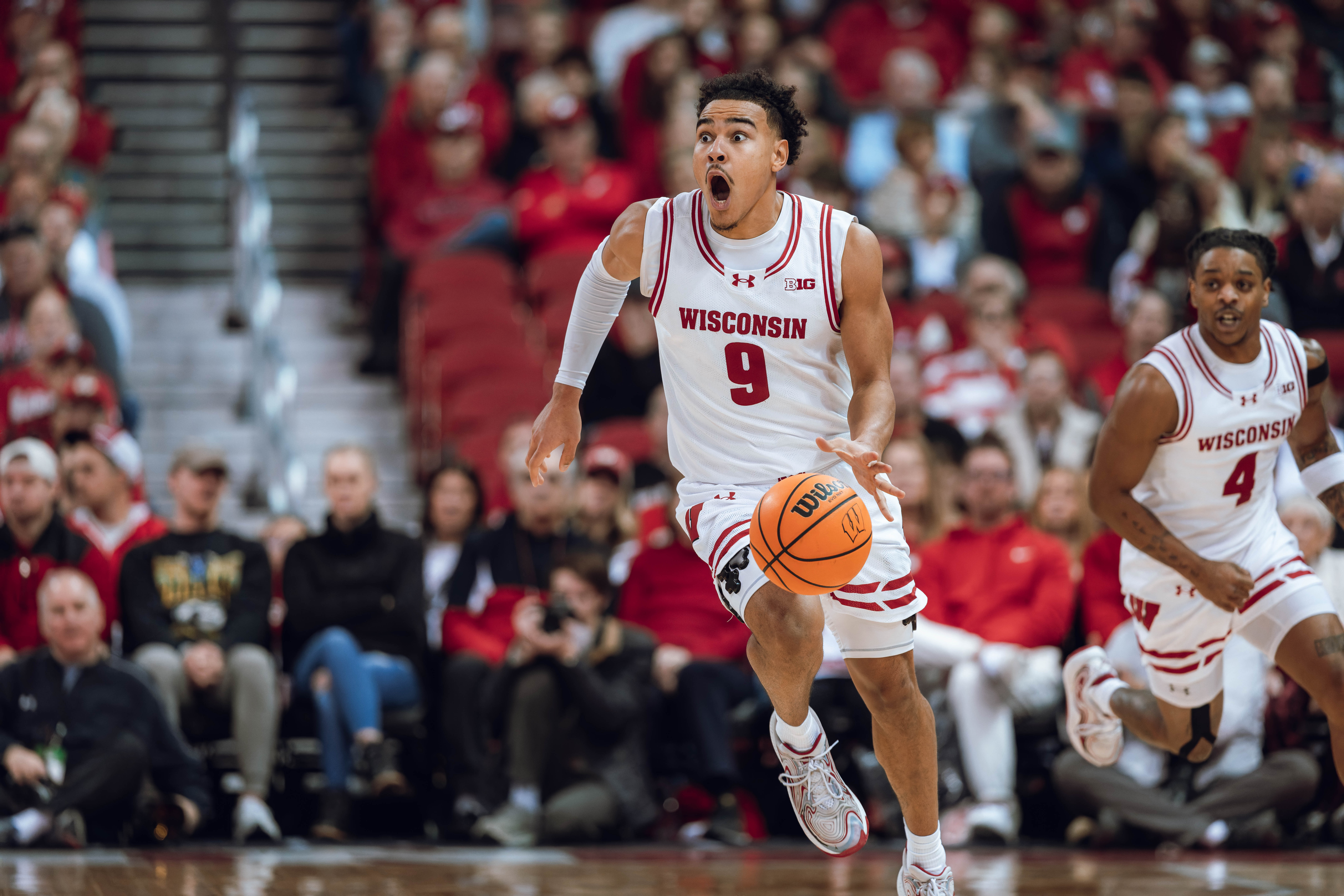 A shocked Wisconsin Badgers guard John Tonje #9 runs a fast break against the Detroit Mercy Titans at Kohl Center on December 22, 2024 in Madison, Wisconsin. Photography by Ross Harried for Second Crop Sports.