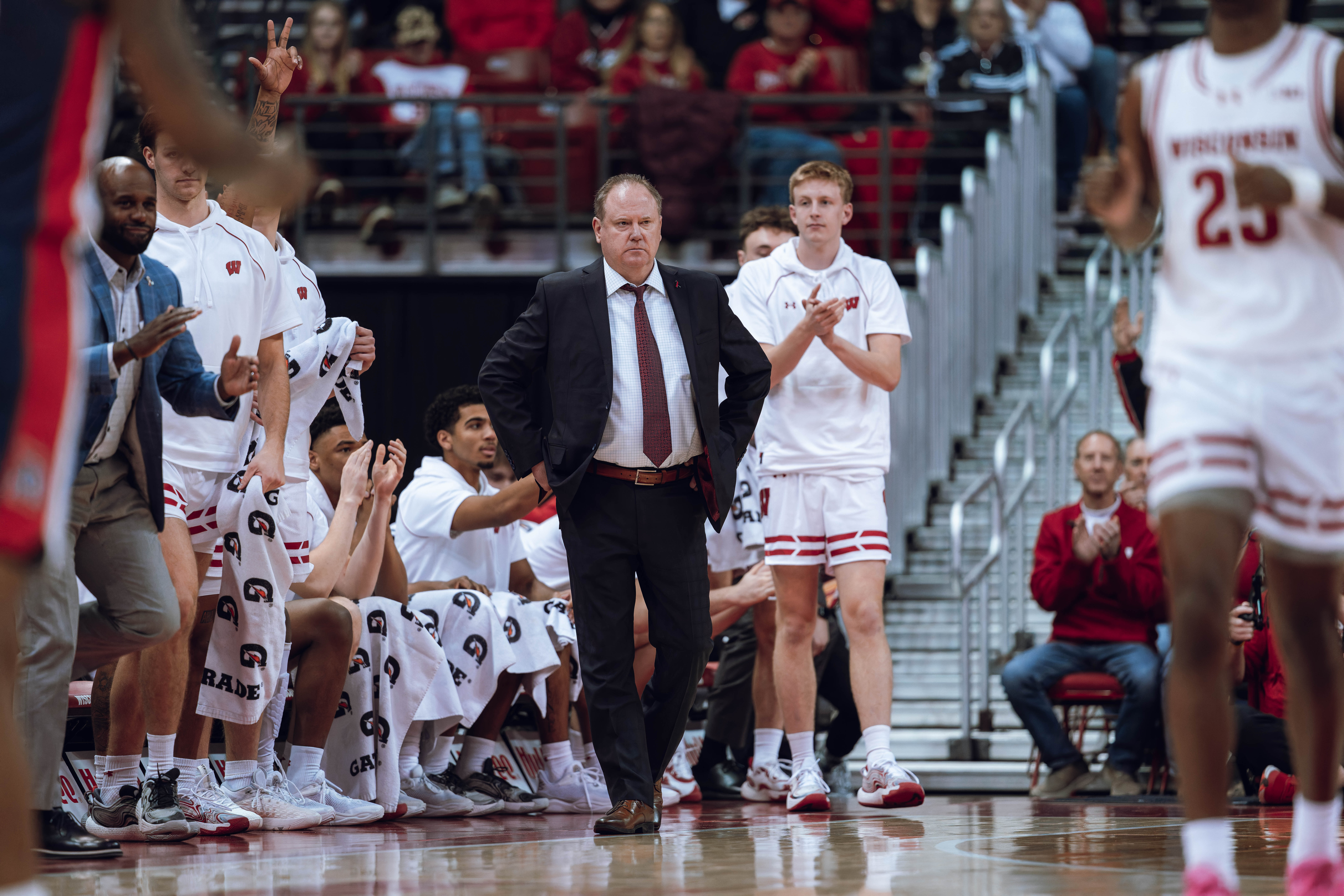 Wisconsin Badgers Head Coach Greg Gard looks on against the Detroit Mercy Titans at Kohl Center on December 22, 2024 in Madison, Wisconsin. Photography by Ross Harried for Second Crop Sports.