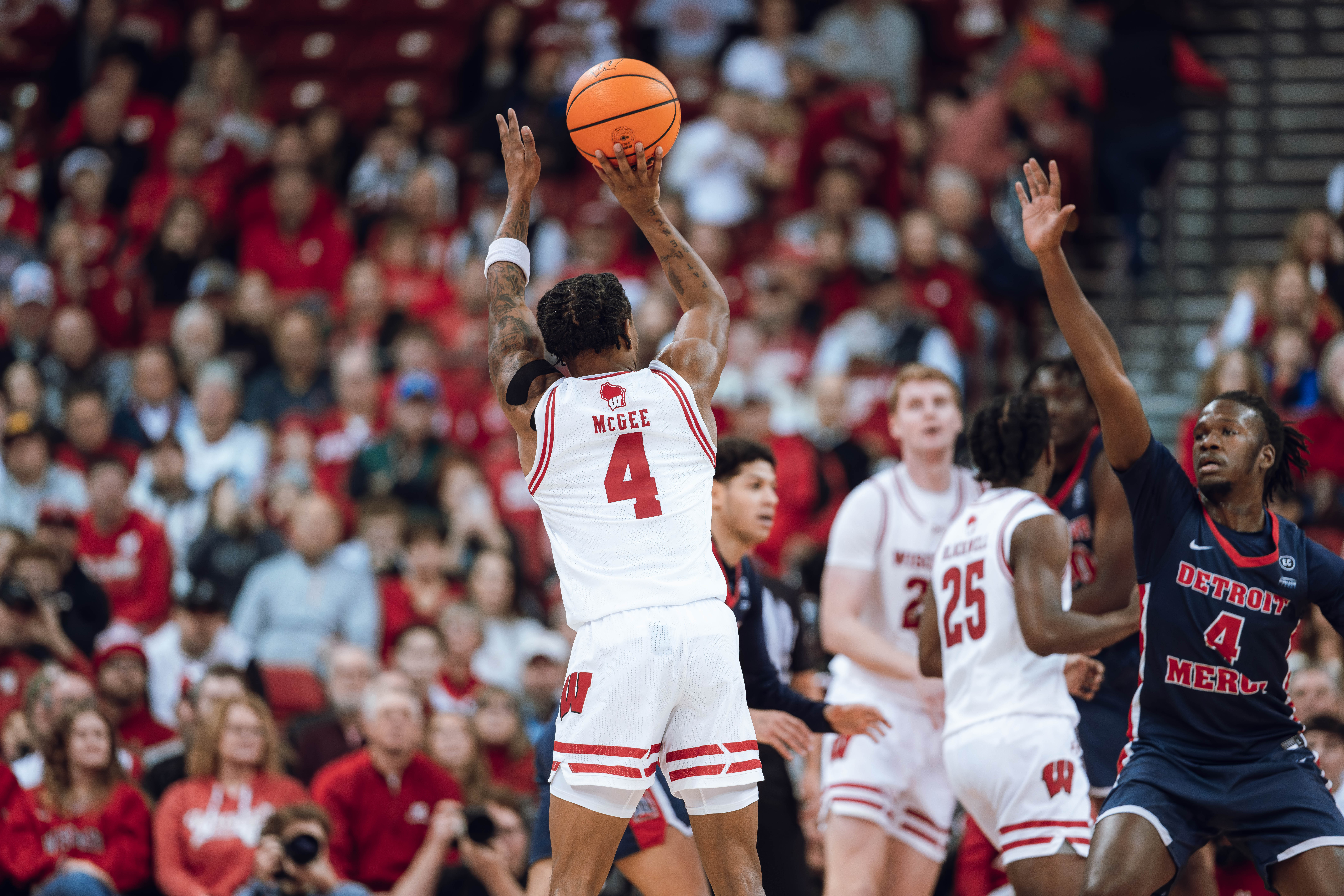 Wisconsin Badgers guard Kamari McGee #4 attempts a jump shot against the Detroit Mercy Titans at Kohl Center on December 22, 2024 in Madison, Wisconsin. Photography by Ross Harried for Second Crop Sports.