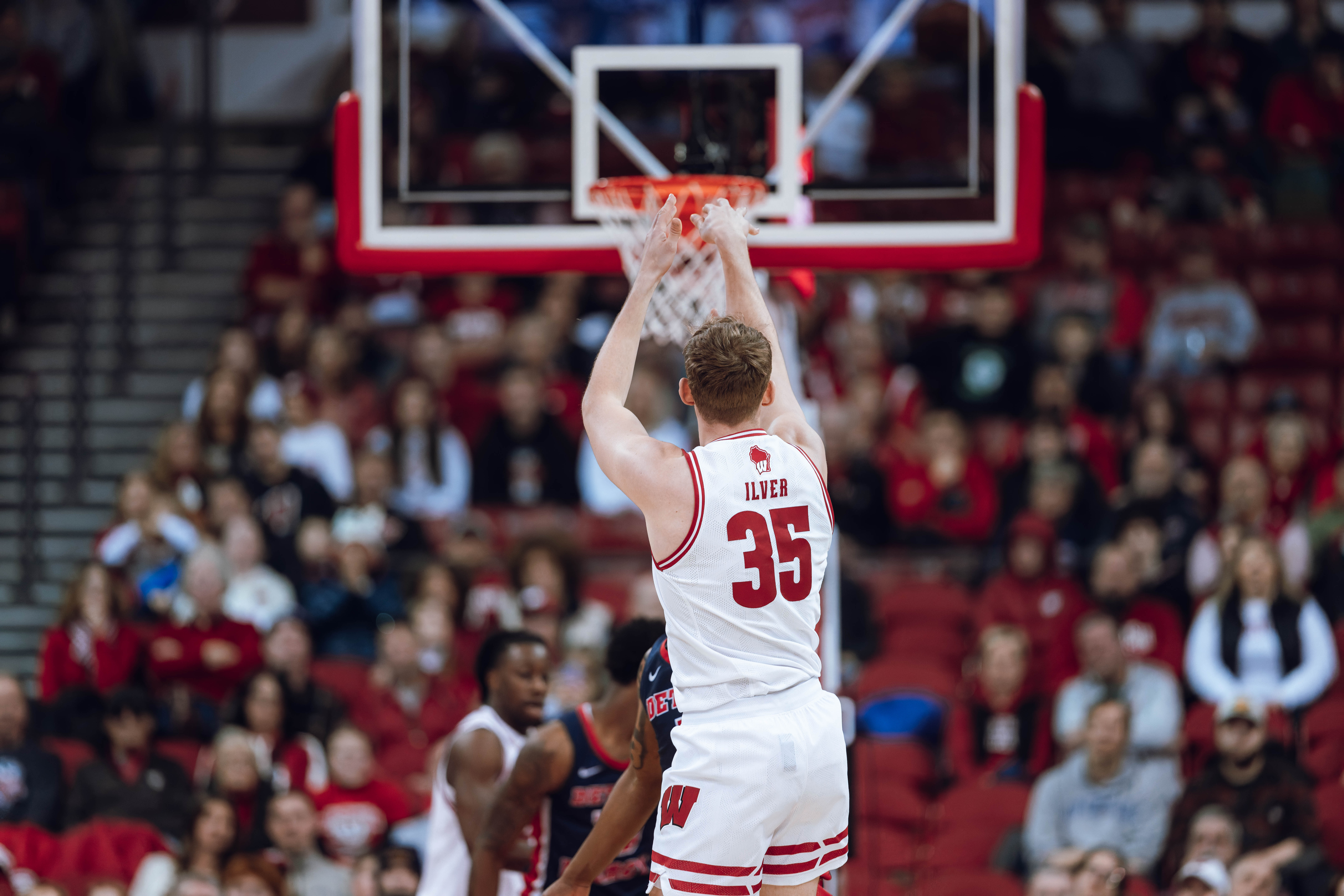 Wisconsin Badgers forward Markus Ilver #35 attempts a 3-pointer against the Detroit Mercy Titans at Kohl Center on December 22, 2024 in Madison, Wisconsin. Photography by Ross Harried for Second Crop Sports.