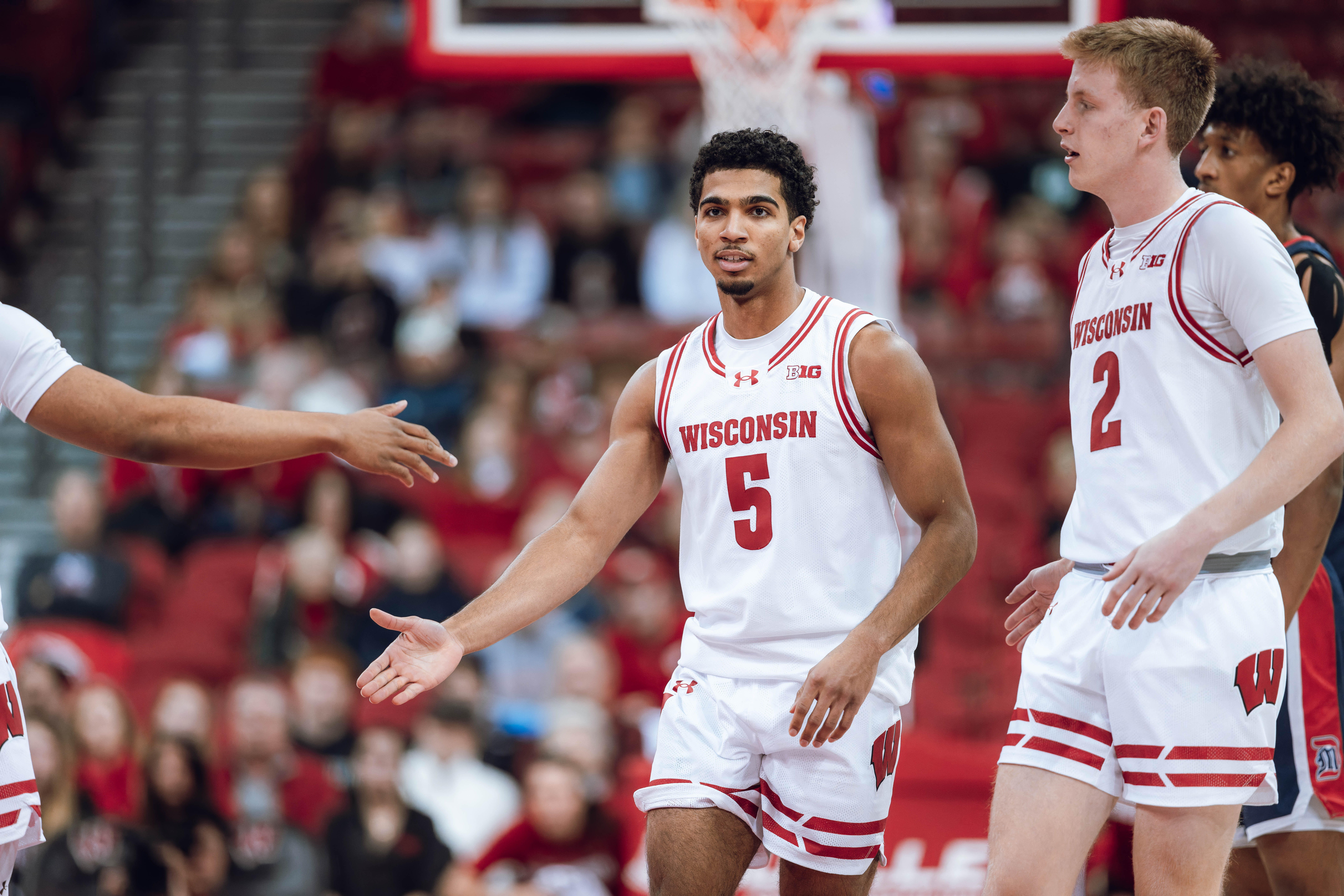 Wisconsin Badgers guard Daniel Freitag #5 celebrates with his teammates late in the second half against the Detroit Mercy Titans at Kohl Center on December 22, 2024 in Madison, Wisconsin. Photography by Ross Harried for Second Crop Sports.