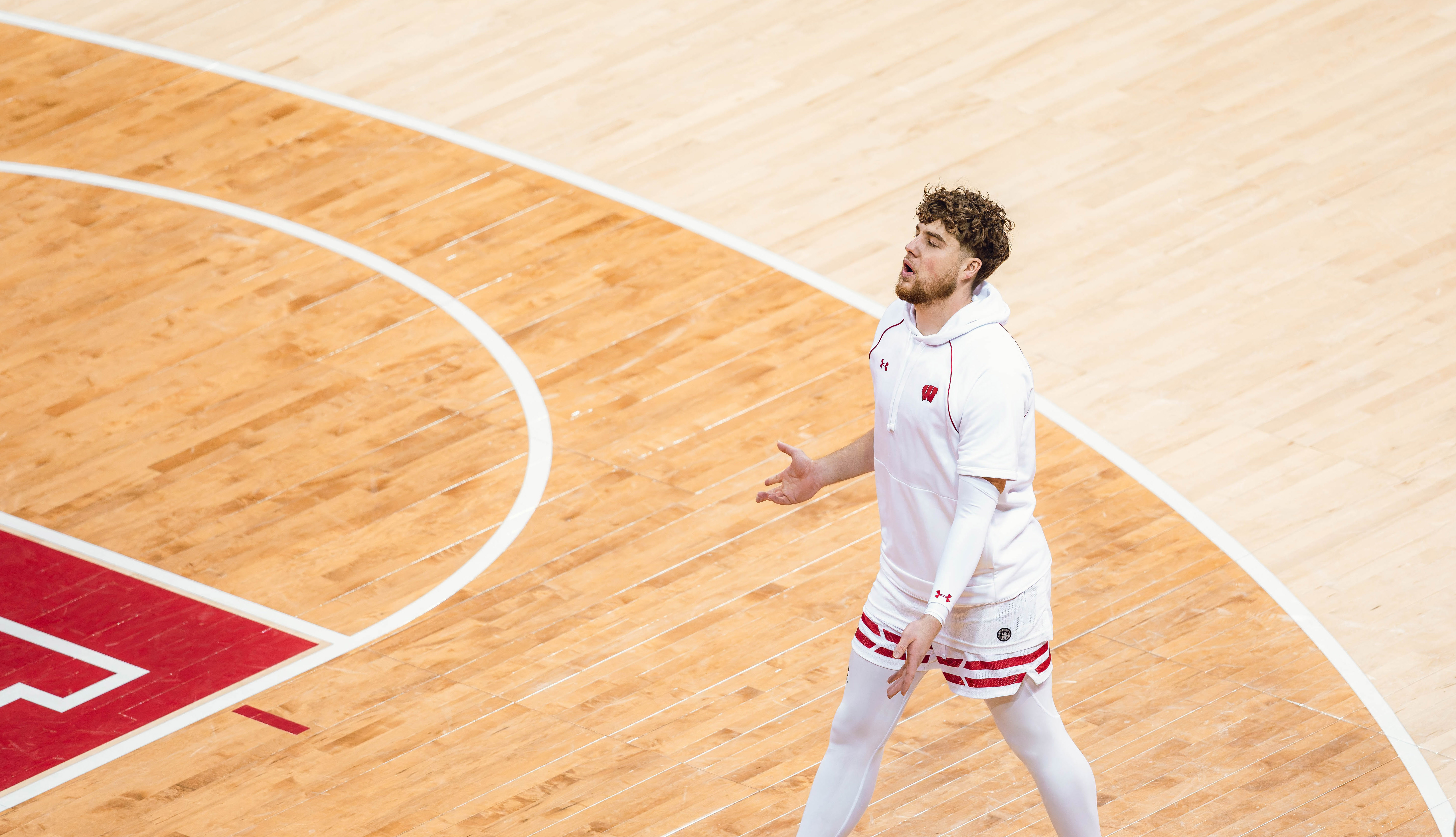 Wisconsin Badgers guard Max Klesmit #11 warms up before taking on the Minnesota Golden Gophers at Kohl Center on January 10, 2025 in Madison, Wisconsin. Photography by Ross Harried for Second Crop Sports.