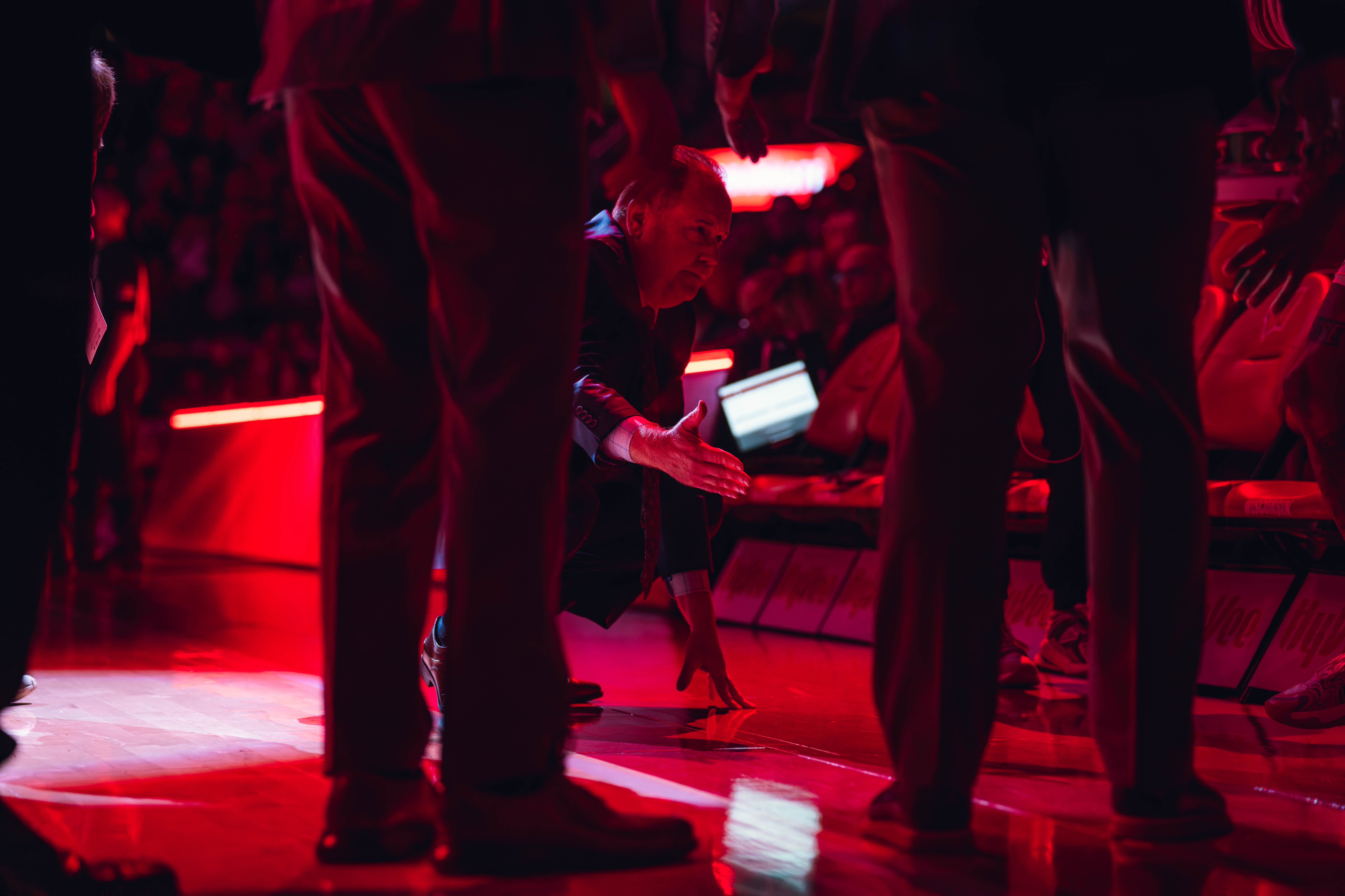 Wisconsin Badgers Head Coach Greg Gard extends his right hand during the starting lineups against the Minnesota Golden Gophers at Kohl Center on January 10, 2025 in Madison, Wisconsin. Photography by Ross Harried for Second Crop Sports.