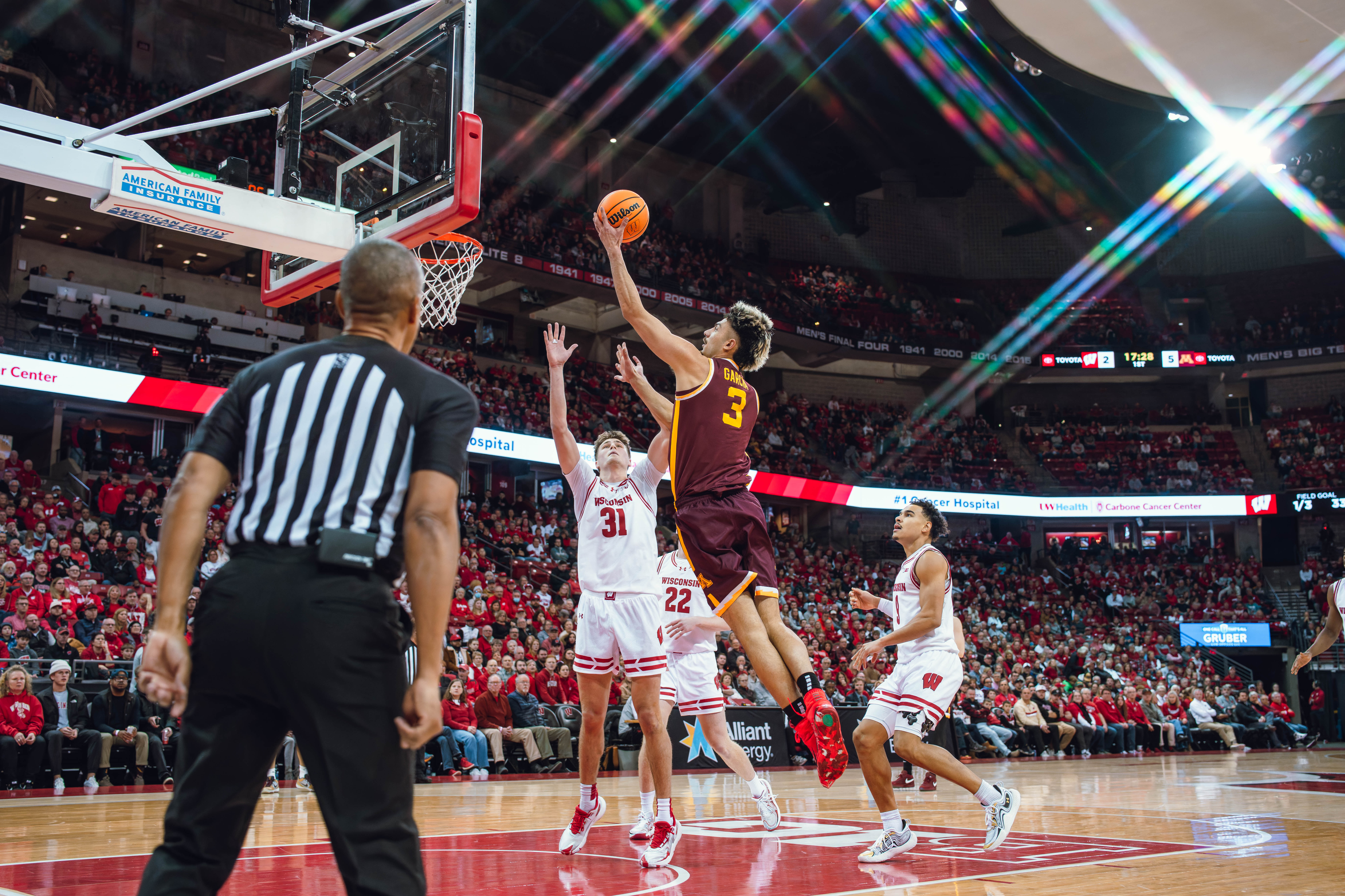 Minnesota Golden Gophers forward Dawson Garcia #3 explodes for a layup against the Wisconsin Badgers at Kohl Center on January 10, 2025 in Madison, Wisconsin. Photography by Ross Harried for Second Crop Sports.