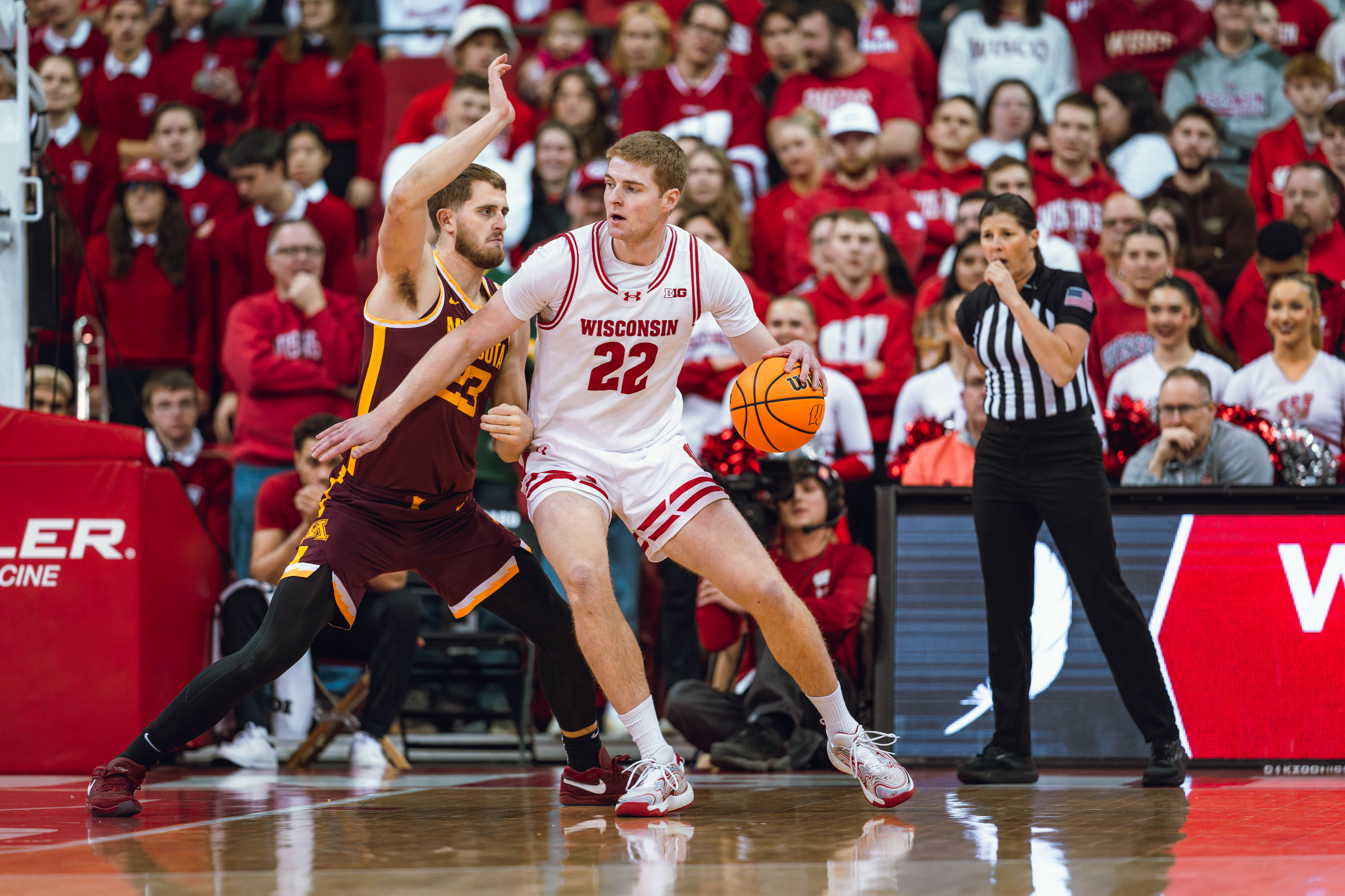 Wisconsin Badgers forward Steven Crowl #22 backs down Minnesota Golden Gophers forward Parker Fox #23 in the post at Kohl Center on January 10, 2025 in Madison, Wisconsin. Photography by Ross Harried for Second Crop Sports.