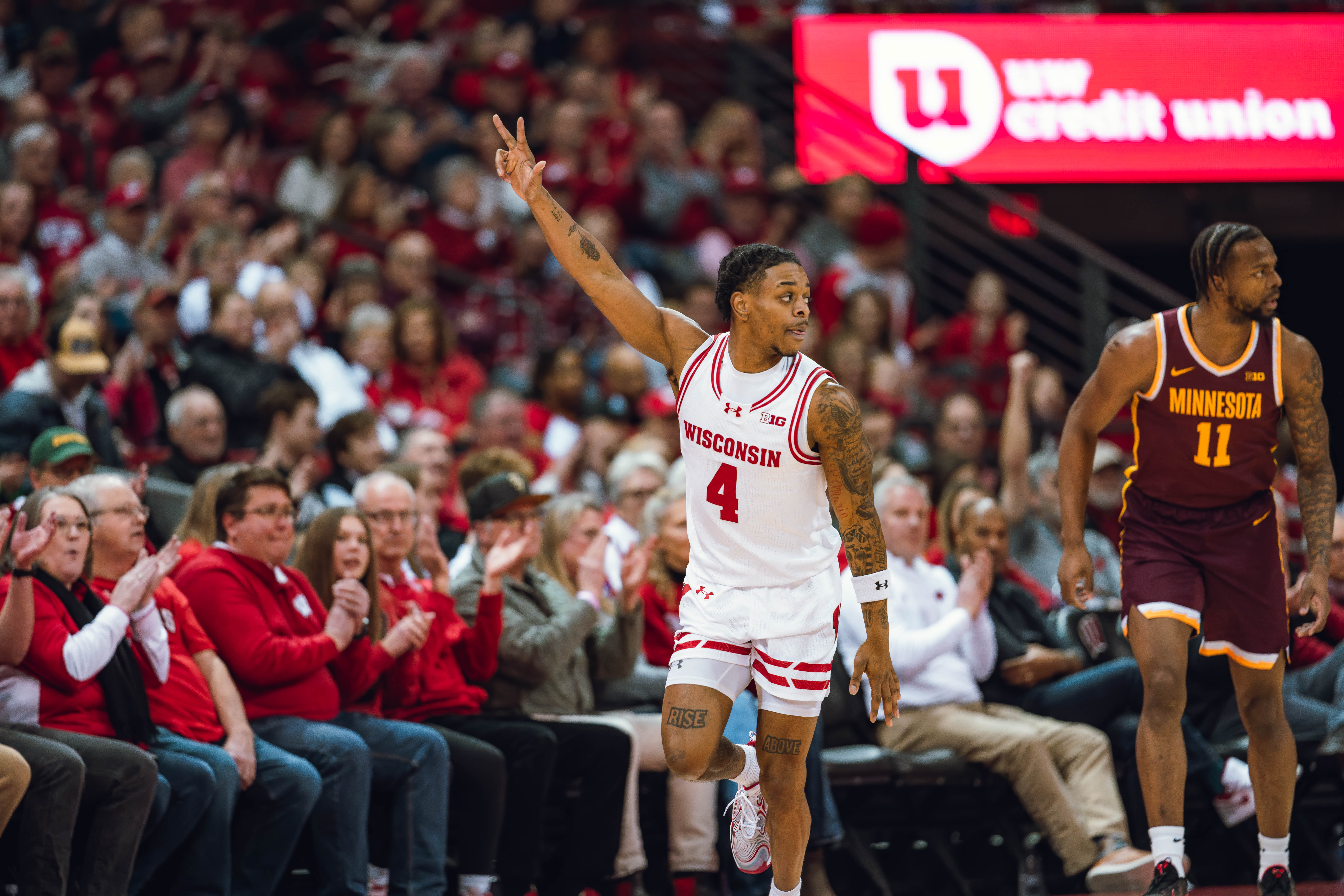 Wisconsin Badgers guard Kamari McGee #4 celebrates a three pointer against the Minnesota Golden Gophers at Kohl Center on January 10, 2025 in Madison, Wisconsin. Photography by Ross Harried for Second Crop Sports.