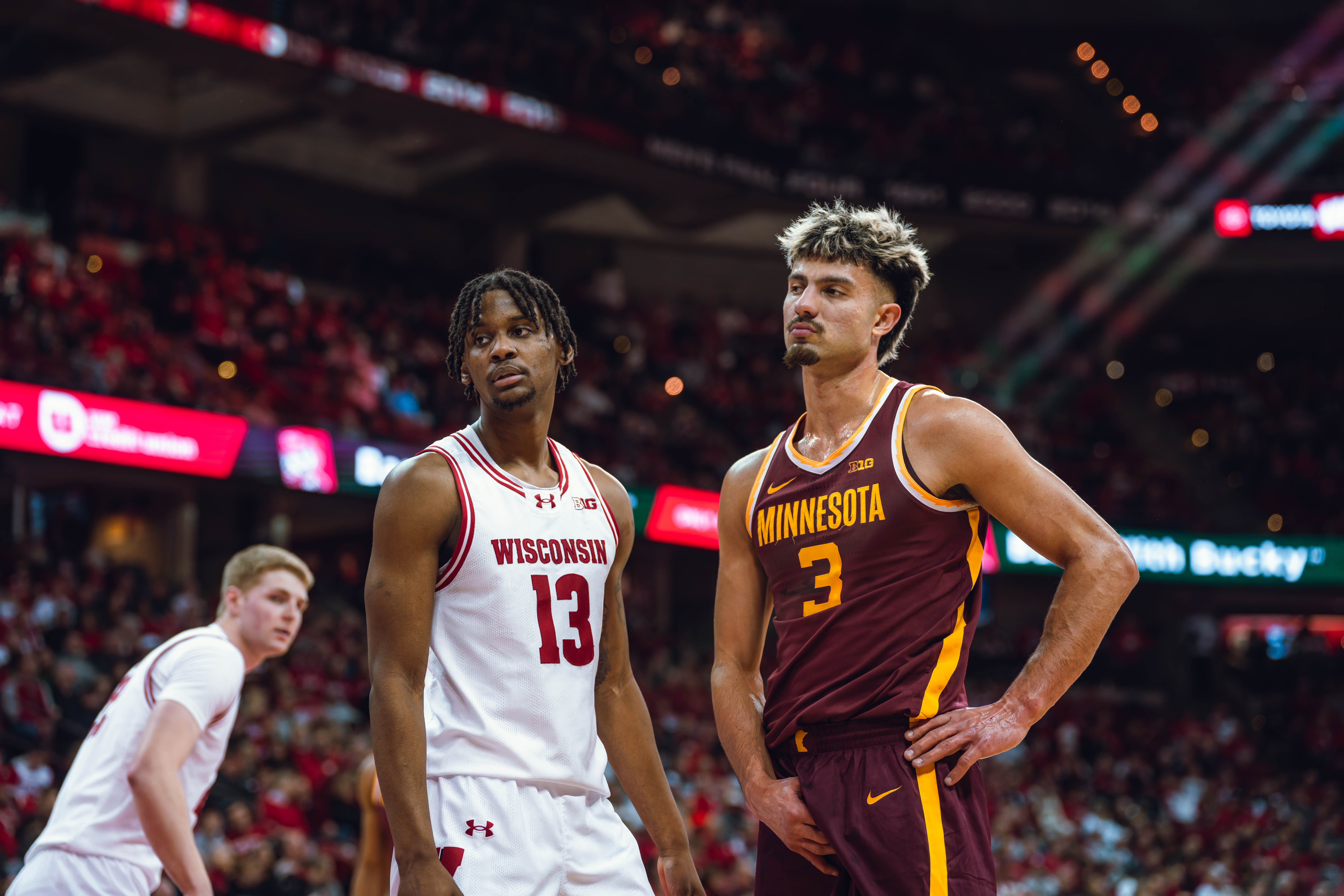 Wisconsin Badgers forward Xavier Amos #13 lines up against Minnesota Golden Gophers forward Dawson Garcia #3 during an inbound play at Kohl Center on January 10, 2025 in Madison, Wisconsin. Photography by Ross Harried for Second Crop Sports.