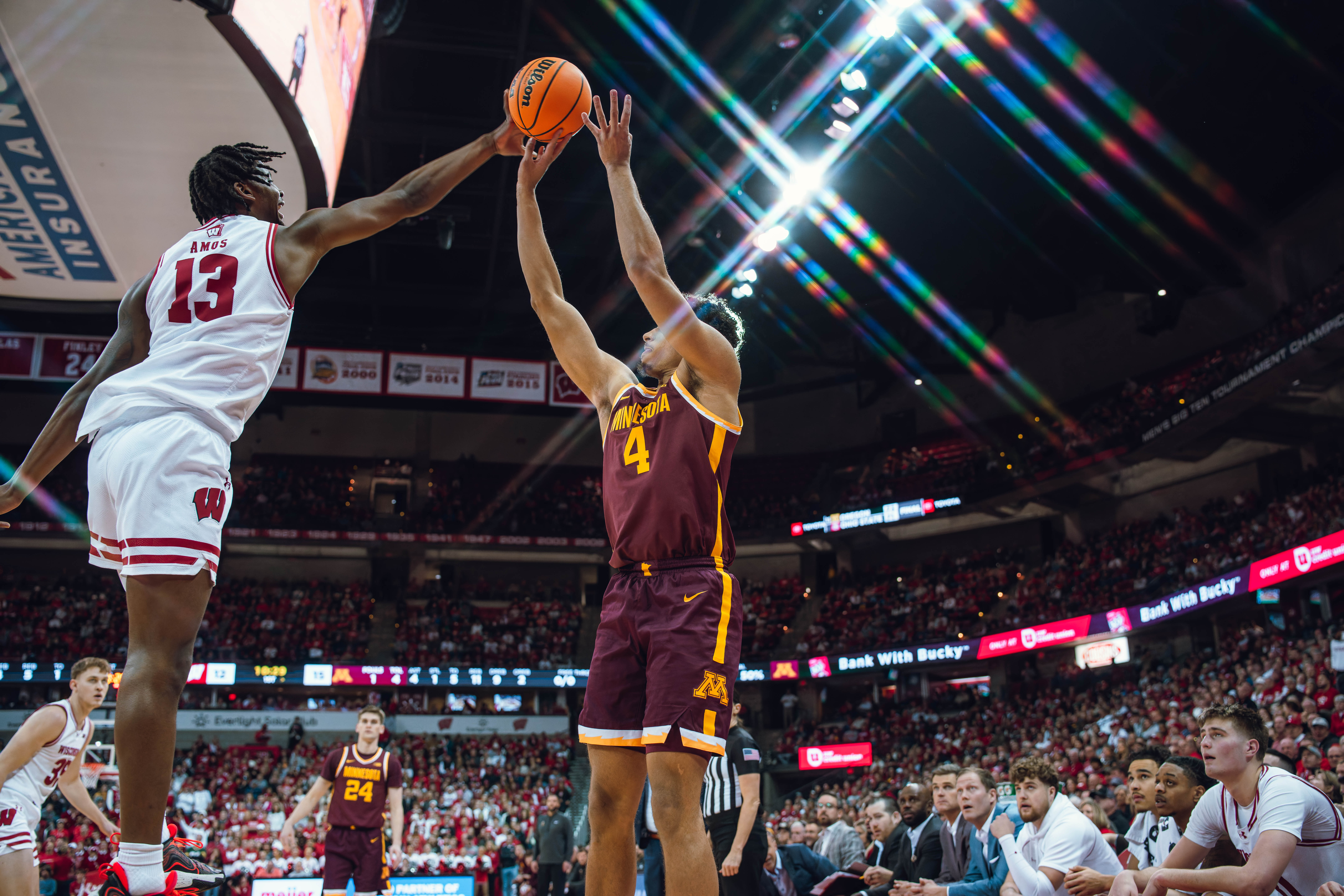 Minnesota Golden Gophers forward Kadyn Betts #4 has his shot blocked by Wisconsin Badgers forward Xavier Amos #13 at Kohl Center on January 10, 2025 in Madison, Wisconsin. Photography by Ross Harried for Second Crop Sports.