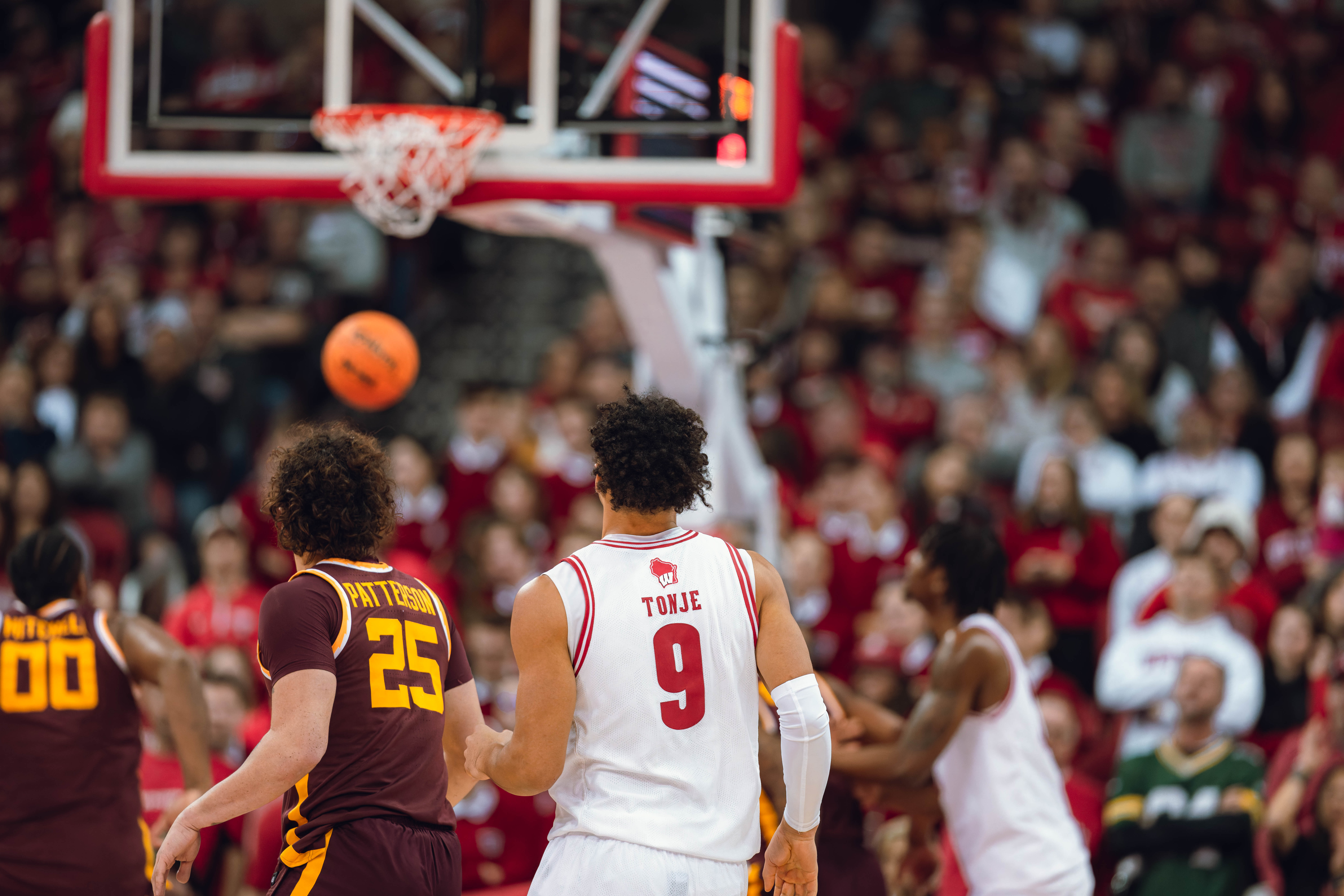 Wisconsin Badgers guard John Tonje #9 watches as his three pointer flushes the net against the Minnesota Golden Gophers at Kohl Center on January 10, 2025 in Madison, Wisconsin. Photography by Ross Harried for Second Crop Sports.