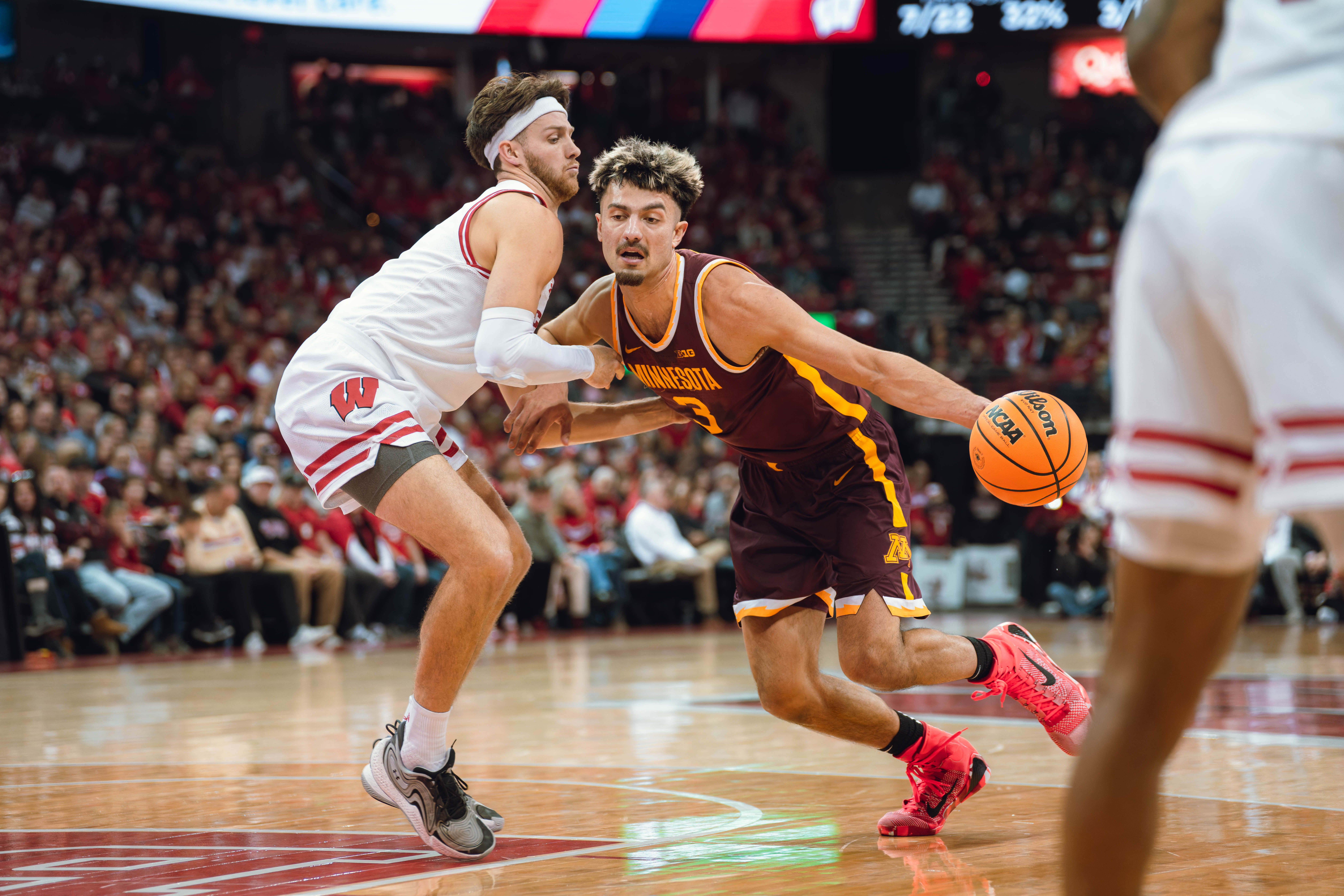 Minnesota Golden Gophers forward Dawson Garcia #3 drives the lane defended by Wisconsin Badgers forward Carter Gilmore #7 at Kohl Center on January 10, 2025 in Madison, Wisconsin. Photography by Ross Harried for Second Crop Sports.