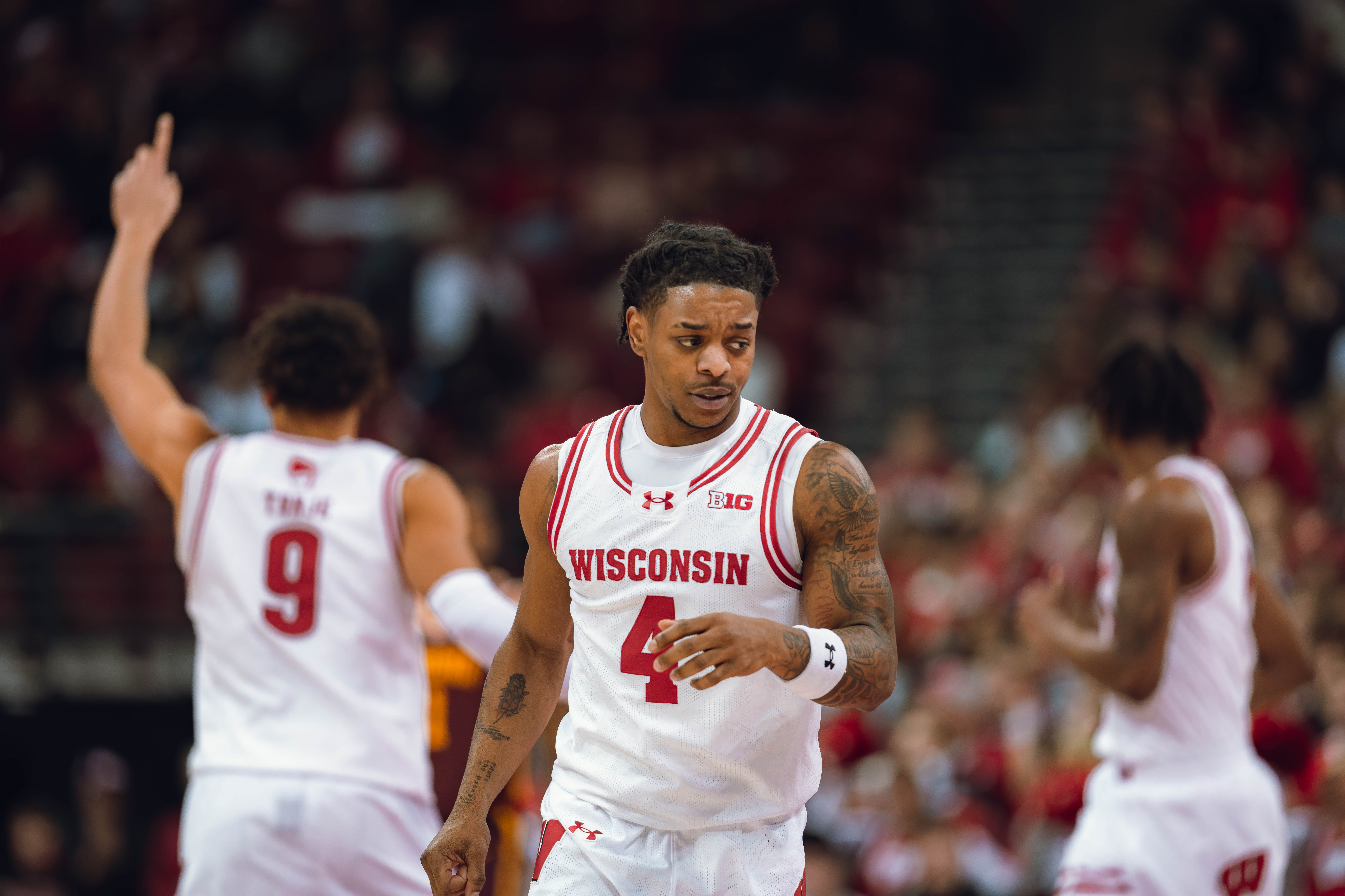 Wisconsin Badgers guard Kamari McGee #4 falls back on defense against the Minnesota Golden Gophers at Kohl Center on January 10, 2025 in Madison, Wisconsin. Photography by Ross Harried for Second Crop Sports.