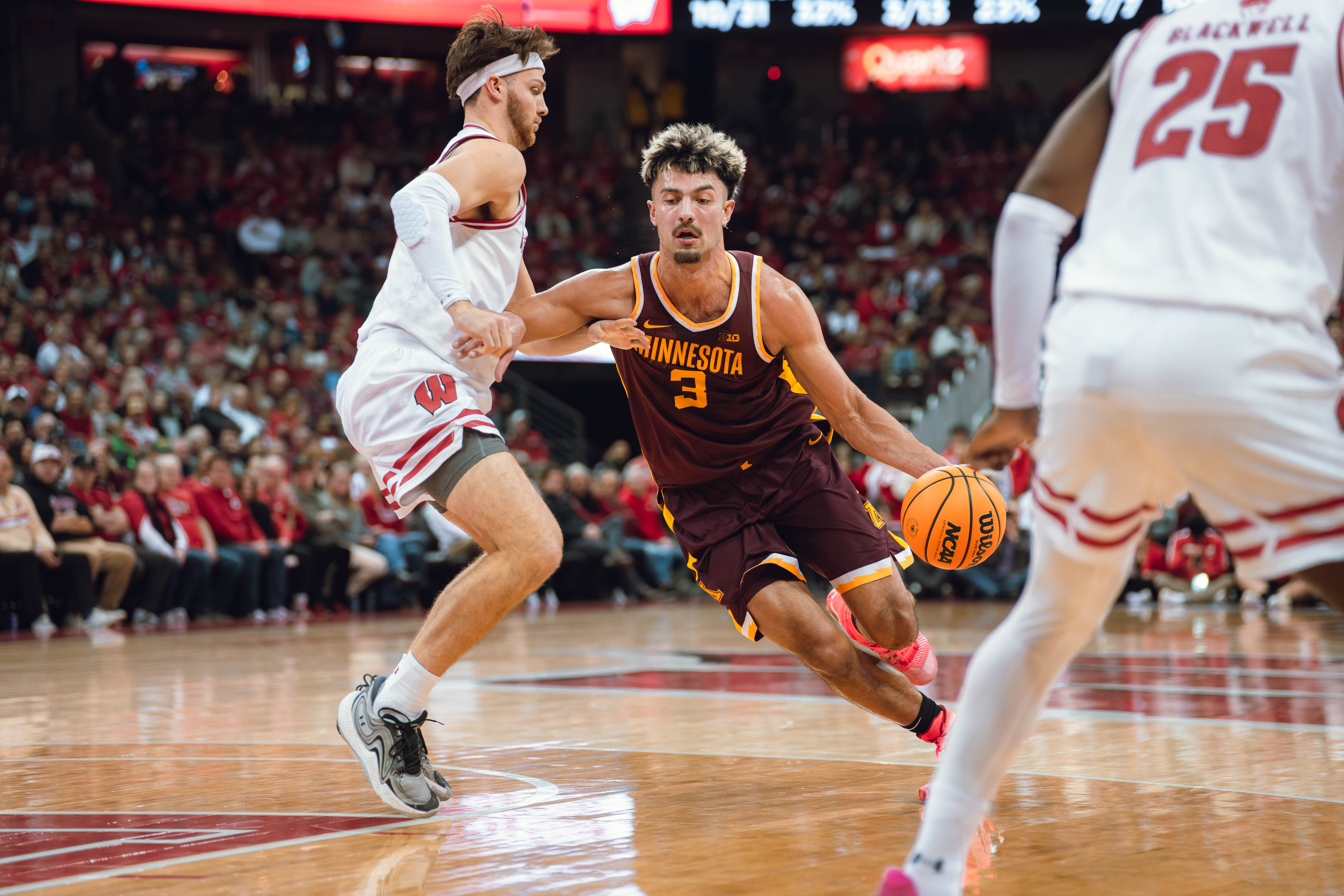 Minnesota Golden Gophers forward Dawson Garcia #3 drives the lane defended by Wisconsin Badgers forward Carter Gilmore #7 at Kohl Center on January 10, 2025 in Madison, Wisconsin. Photography by Ross Harried for Second Crop Sports.