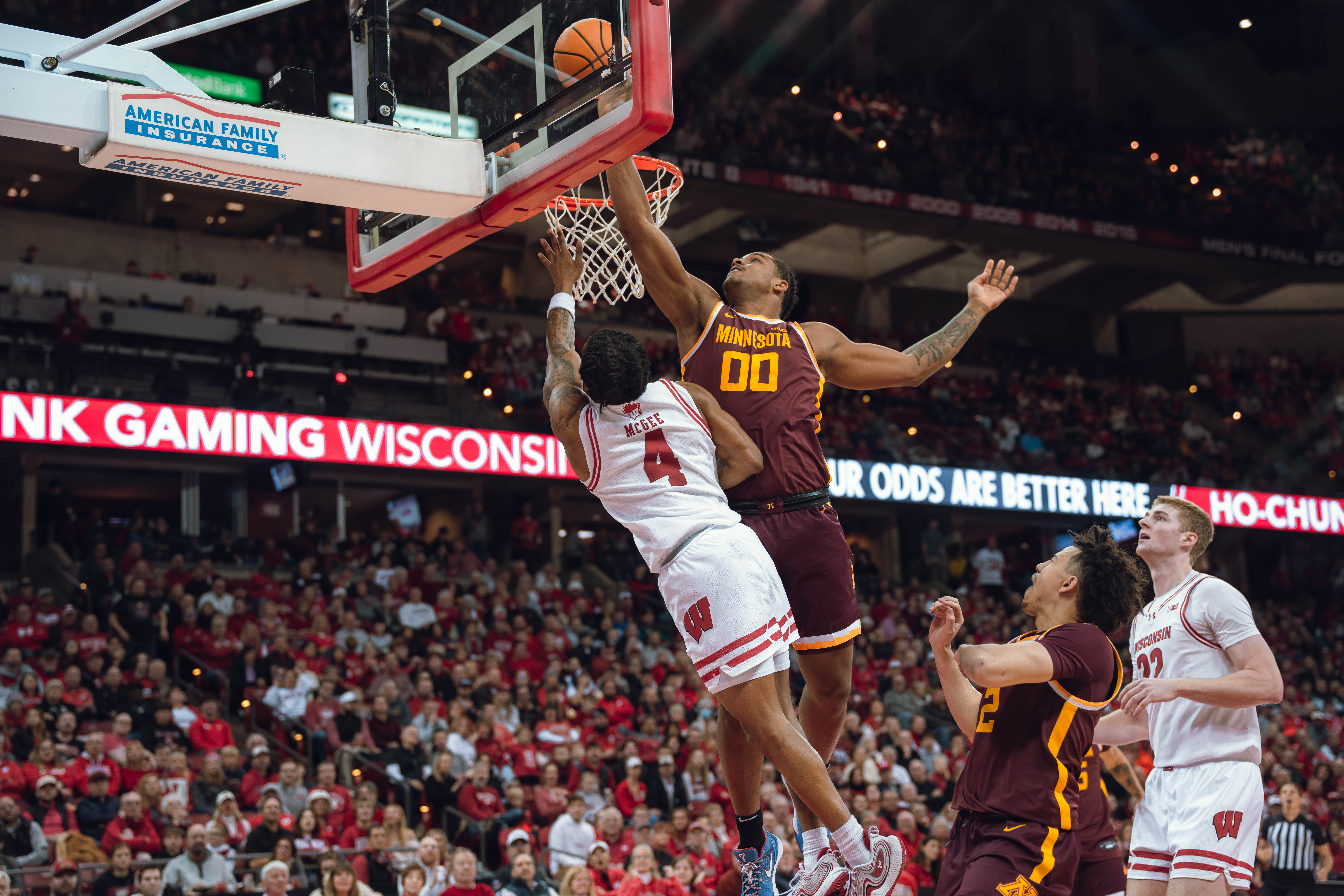 Minnesota Golden Gophers forward Frank Mitchell #0 gets called for goaltending on a Wisconsin Badgers guard Kamari McGee #4 layup at Kohl Center on January 10, 2025 in Madison, Wisconsin. Photography by Ross Harried for Second Crop Sports.