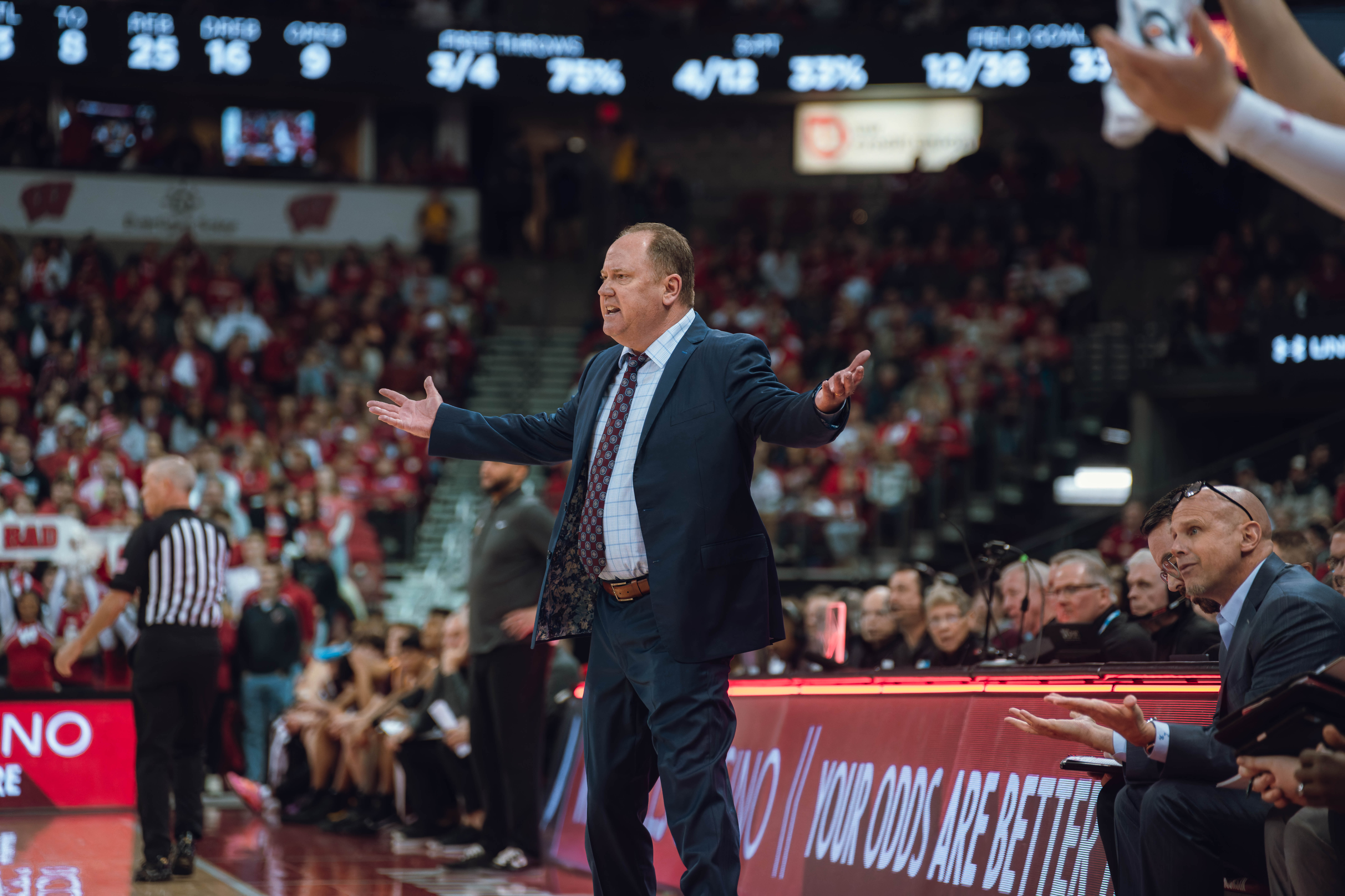 Wisconsin Badgers Head Coach Greg Gard throws his arms out in disbelief against the Minnesota Golden Gophers at Kohl Center on January 10, 2025 in Madison, Wisconsin. Photography by Ross Harried for Second Crop Sports.