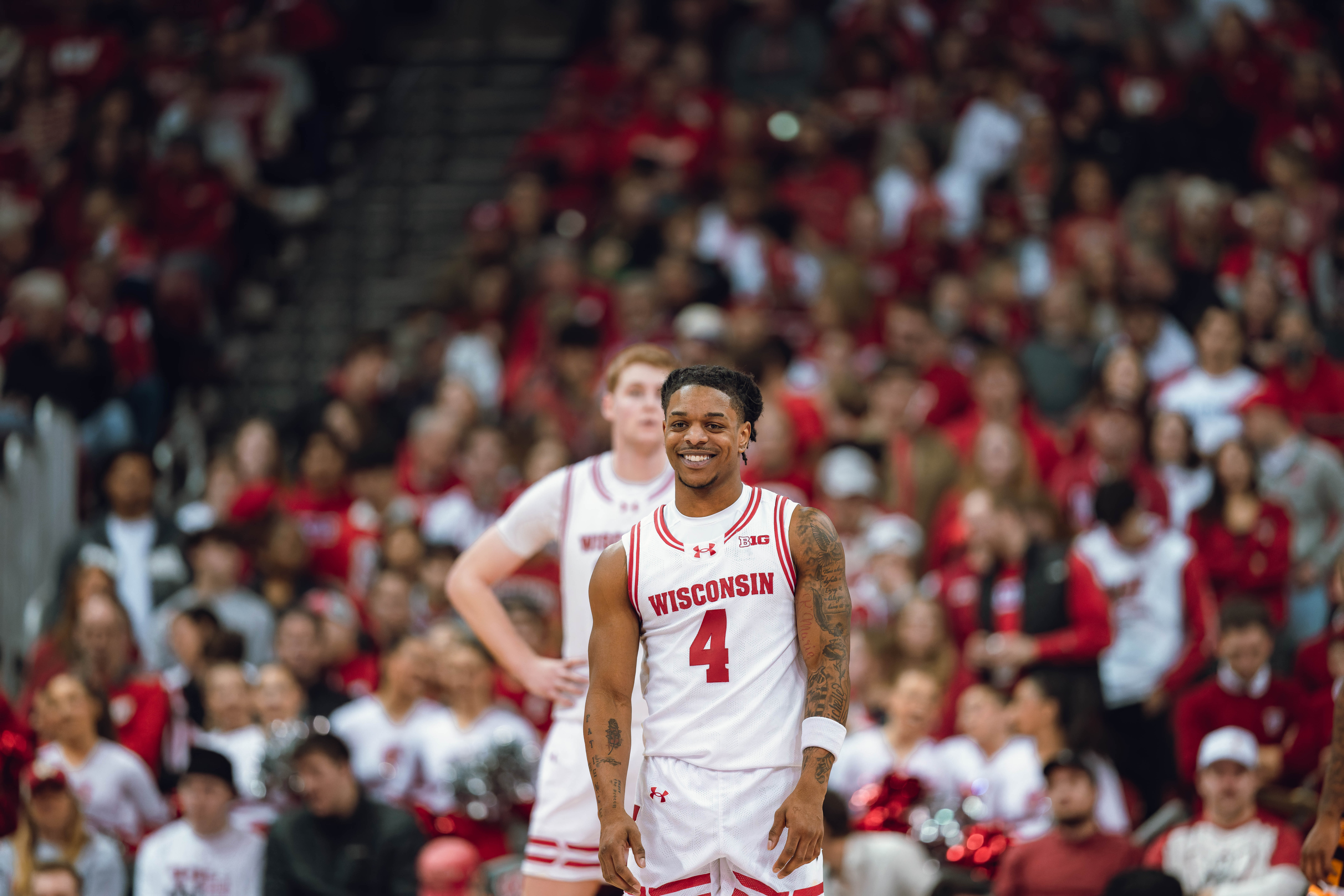 Wisconsin Badgers guard Kamari McGee #4 flashes a smile against the Minnesota Golden Gophers at Kohl Center on January 10, 2025 in Madison, Wisconsin. Photography by Ross Harried for Second Crop Sports.