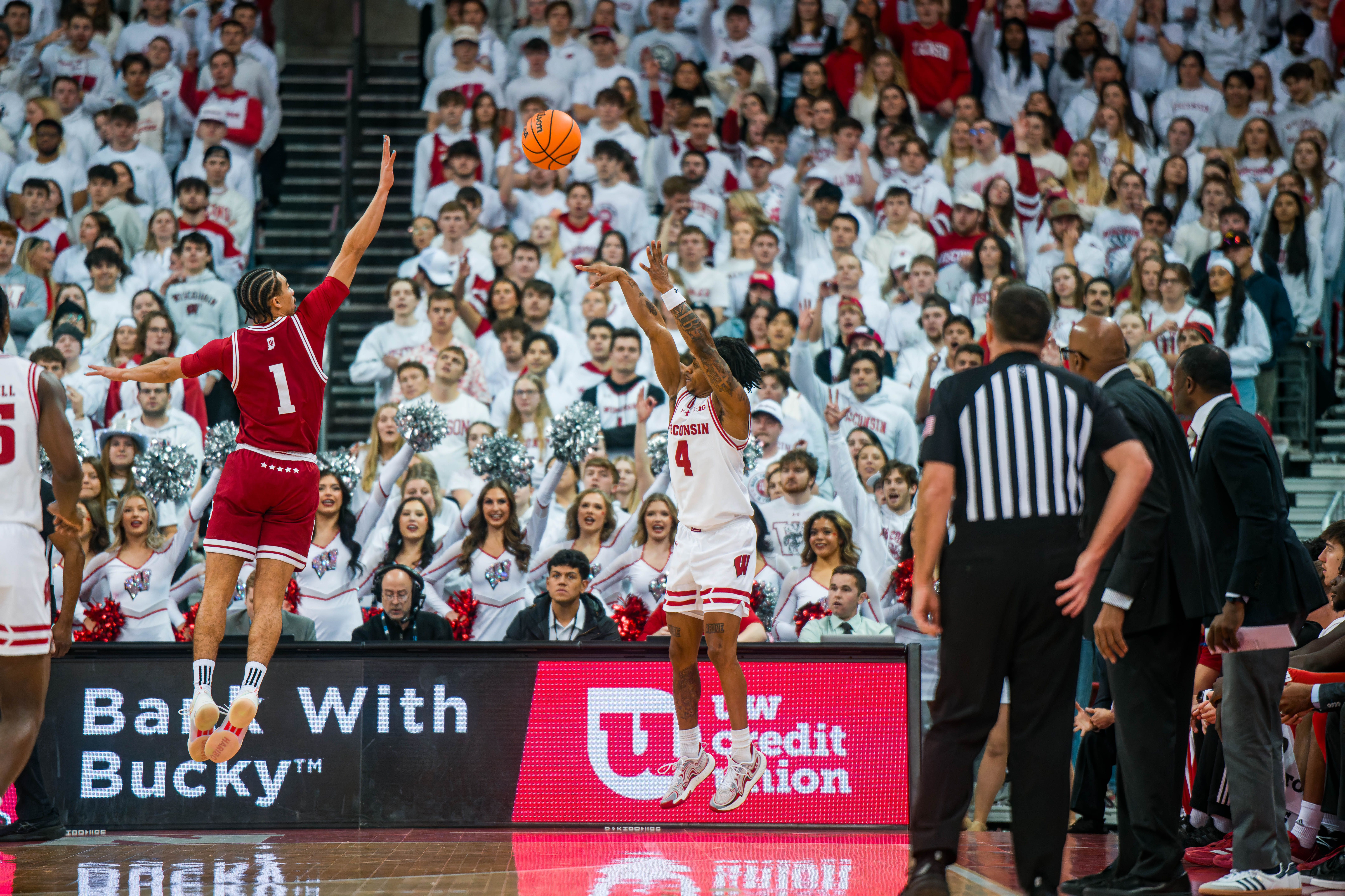 Wisconsin Badgers guard Kamari McGee #4 shoots a three over Indiana Hoosiers Guard Myles Rice #1 at the Kohl Center on February 04, 2025 in Madison, Wisconsin. Photography by Ross Harried for Second Crop Sports.