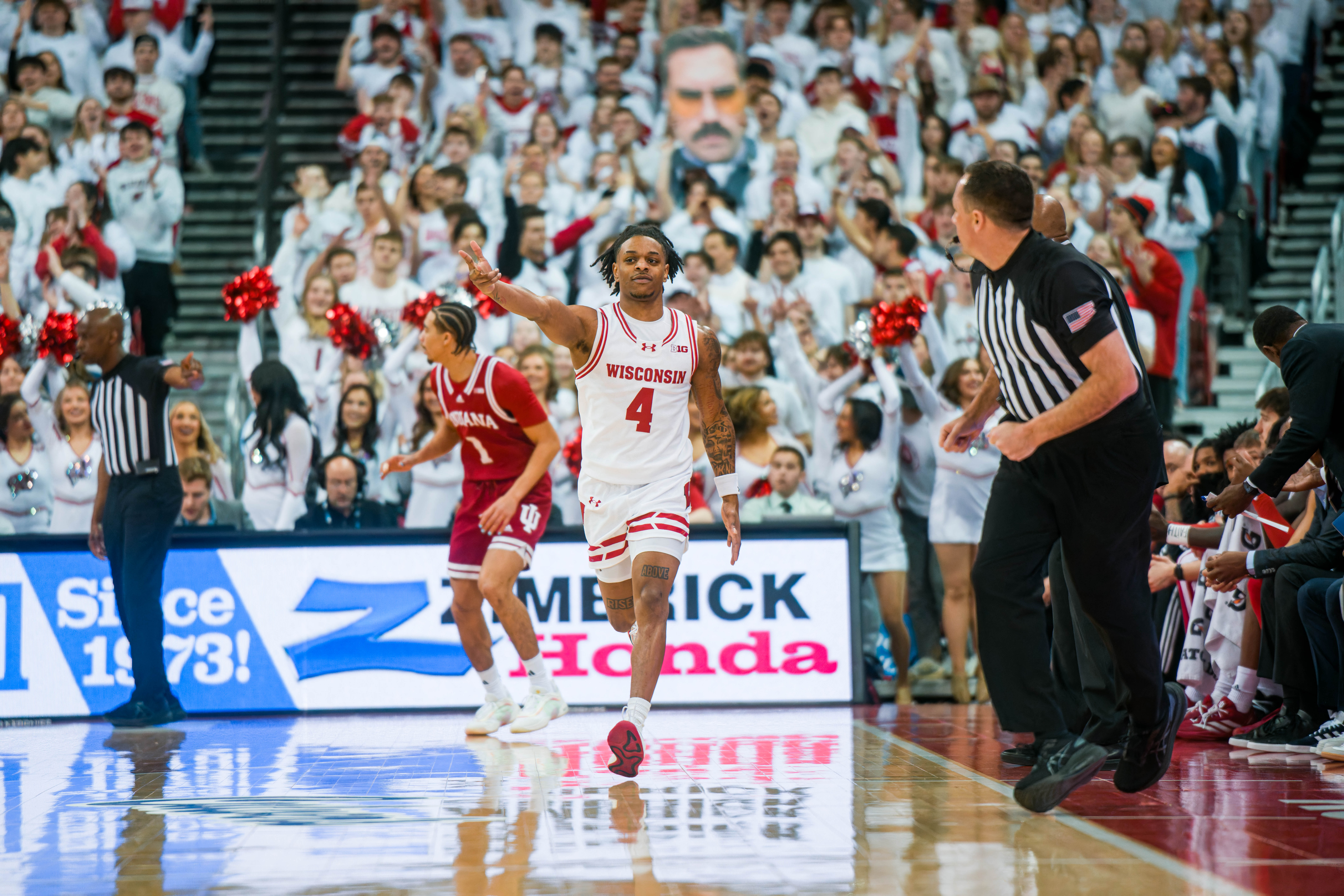 Wisconsin Badgers guard Kamari McGee #4 celebrates a three pointer against the Indiana Hoosiers at the Kohl Center on February 04, 2025 in Madison, Wisconsin. Photography by Ross Harried for Second Crop Sports.