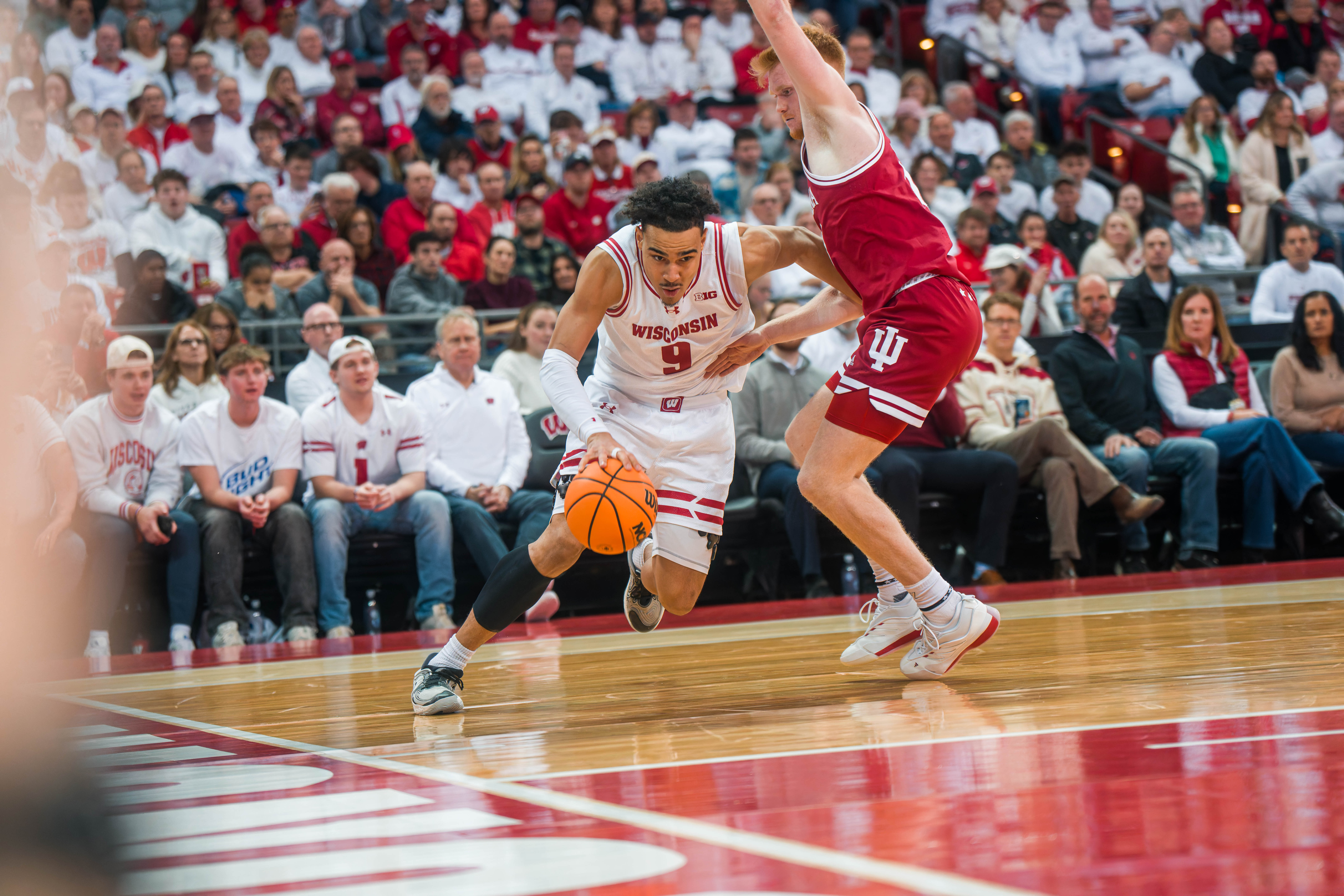 Wisconsin Badgers guard John Tonje #9 drives the baseline past Indiana Hoosiers Forward Luke Goode #10 at the Kohl Center on February 04, 2025 in Madison, Wisconsin. Photography by Ross Harried for Second Crop Sports.