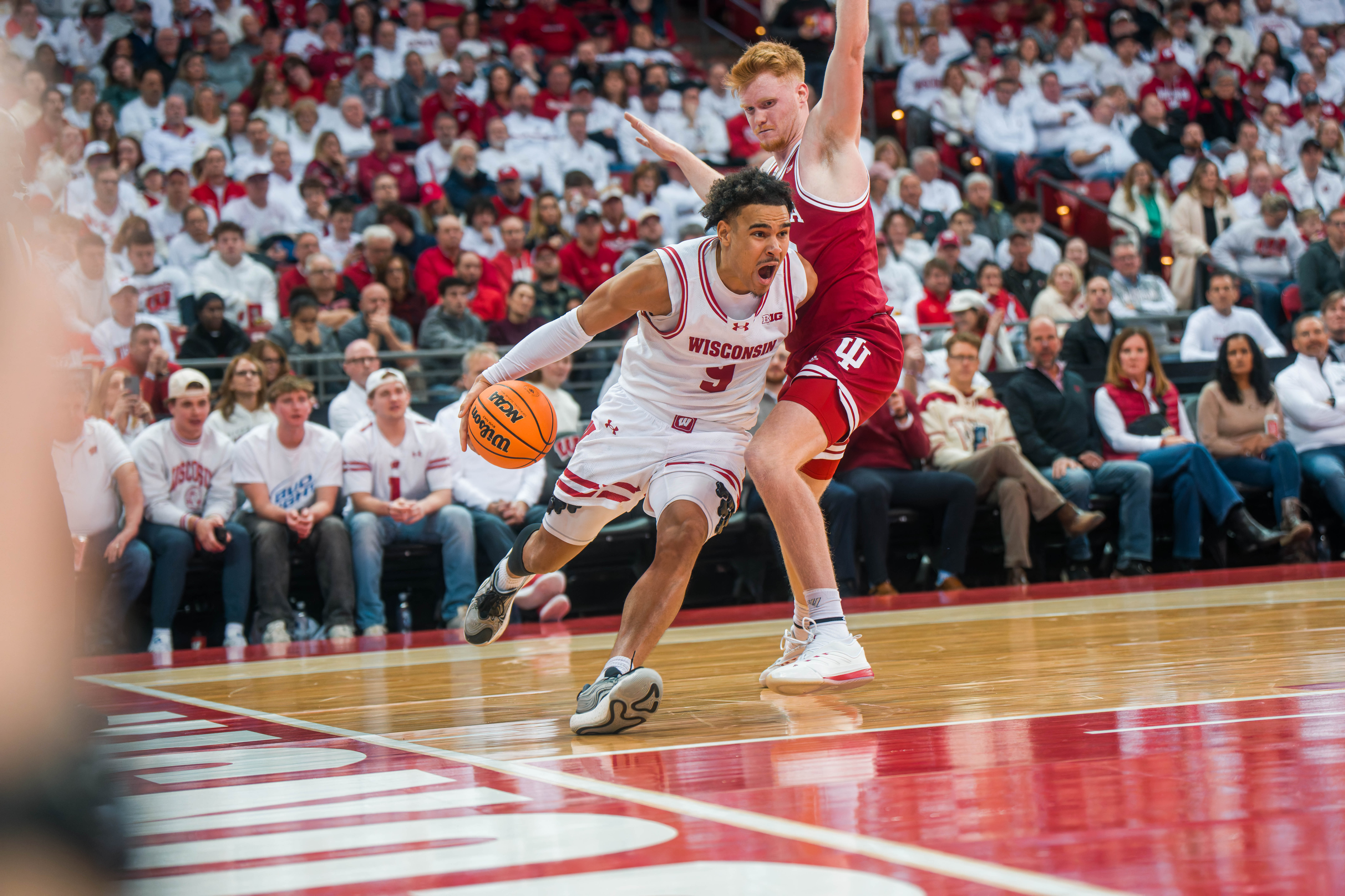 Wisconsin Badgers guard John Tonje #9 drives the baseline past Indiana Hoosiers Forward Luke Goode #10 at the Kohl Center on February 04, 2025 in Madison, Wisconsin. Photography by Ross Harried for Second Crop Sports.