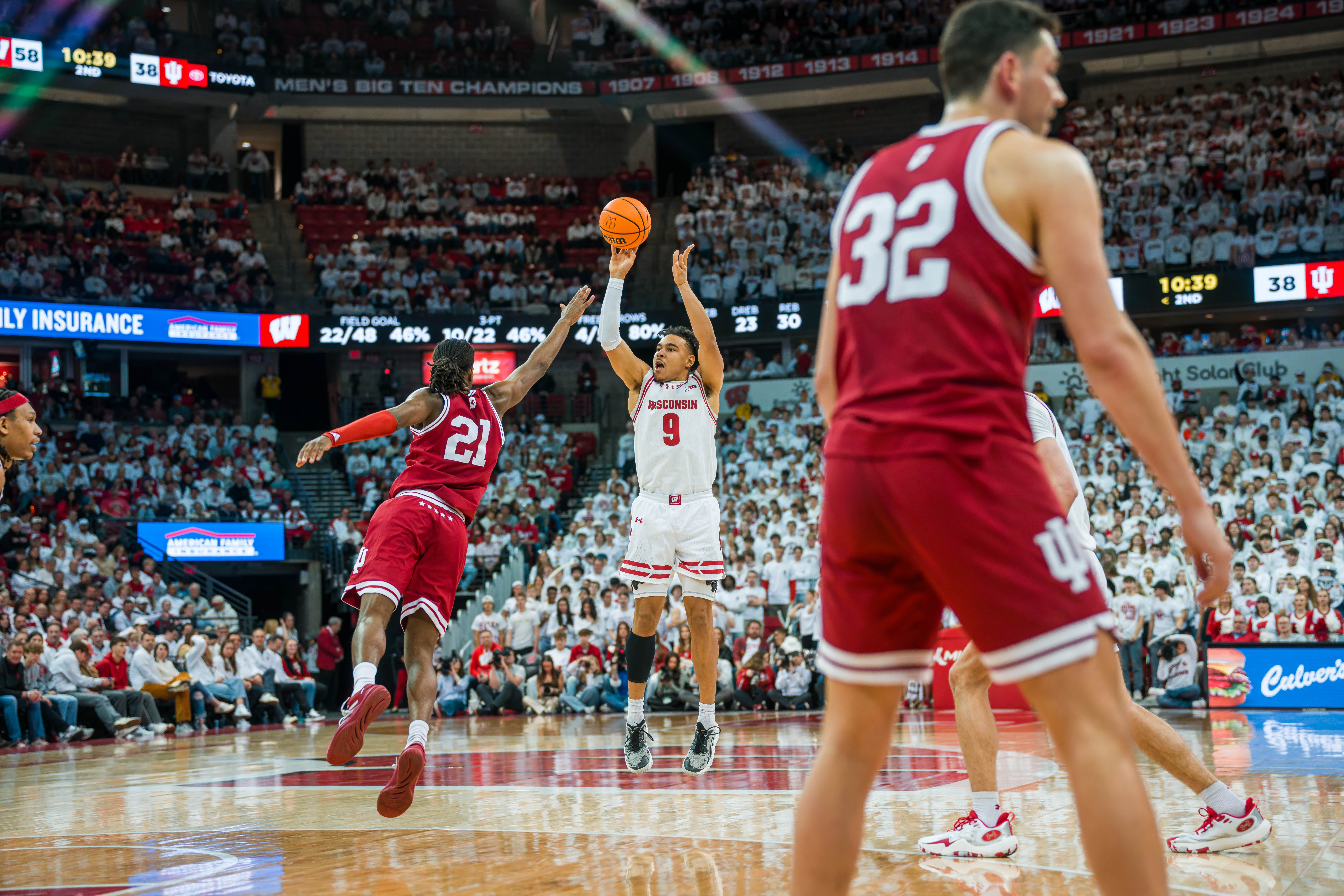 Wisconsin Badgers guard John Tonje #9 shoots a three pointer over Indiana Hoosiers Forward Mackenzie Mgbako #21 at the Kohl Center on February 04, 2025 in Madison, Wisconsin. Photography by Ross Harried for Second Crop Sports.