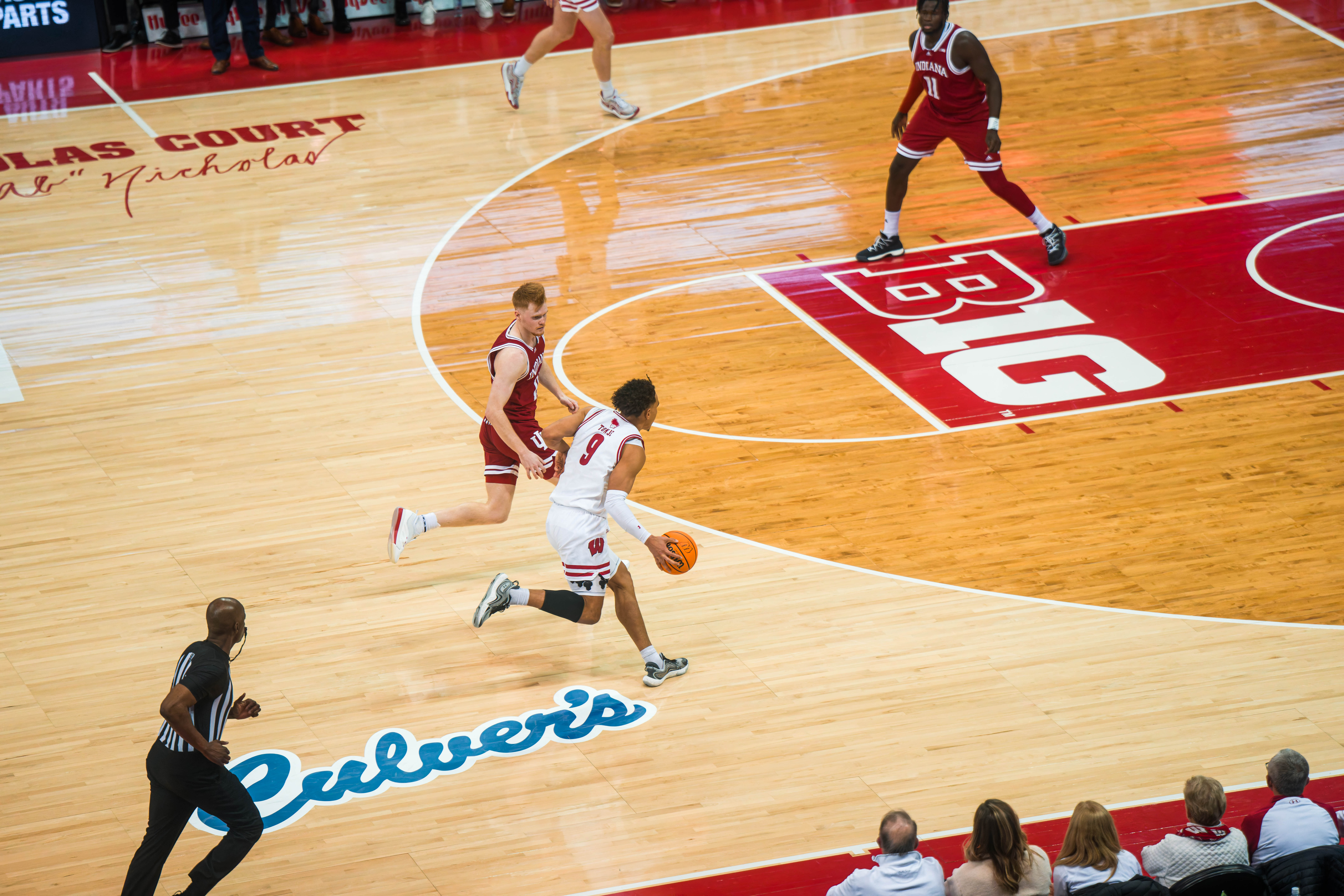 Wisconsin Badgers guard John Tonje #9 pushes the ball up the court against the Indiana Hoosiers at the Kohl Center on February 04, 2025 in Madison, Wisconsin. Photography by Ross Harried for Second Crop Sports.