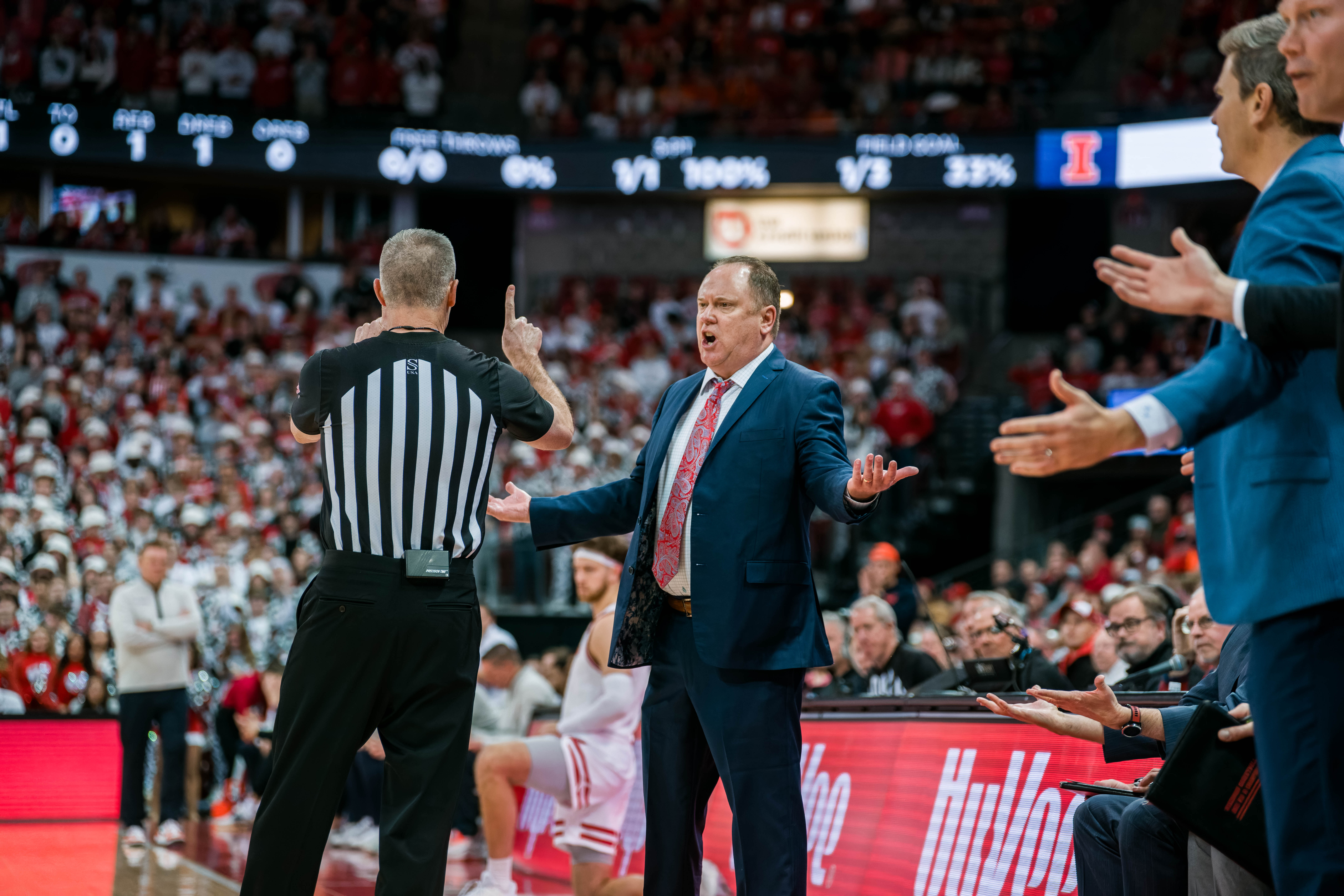 Wisconsin Badgers Head Coach Greg Gard argues a call in the first half of the game against the Illinois Fighting Illini at The Kohl Center on February 18, 2025 in Madison, Wisconsin. Photography by Ross Harried for Second Crop Sports.