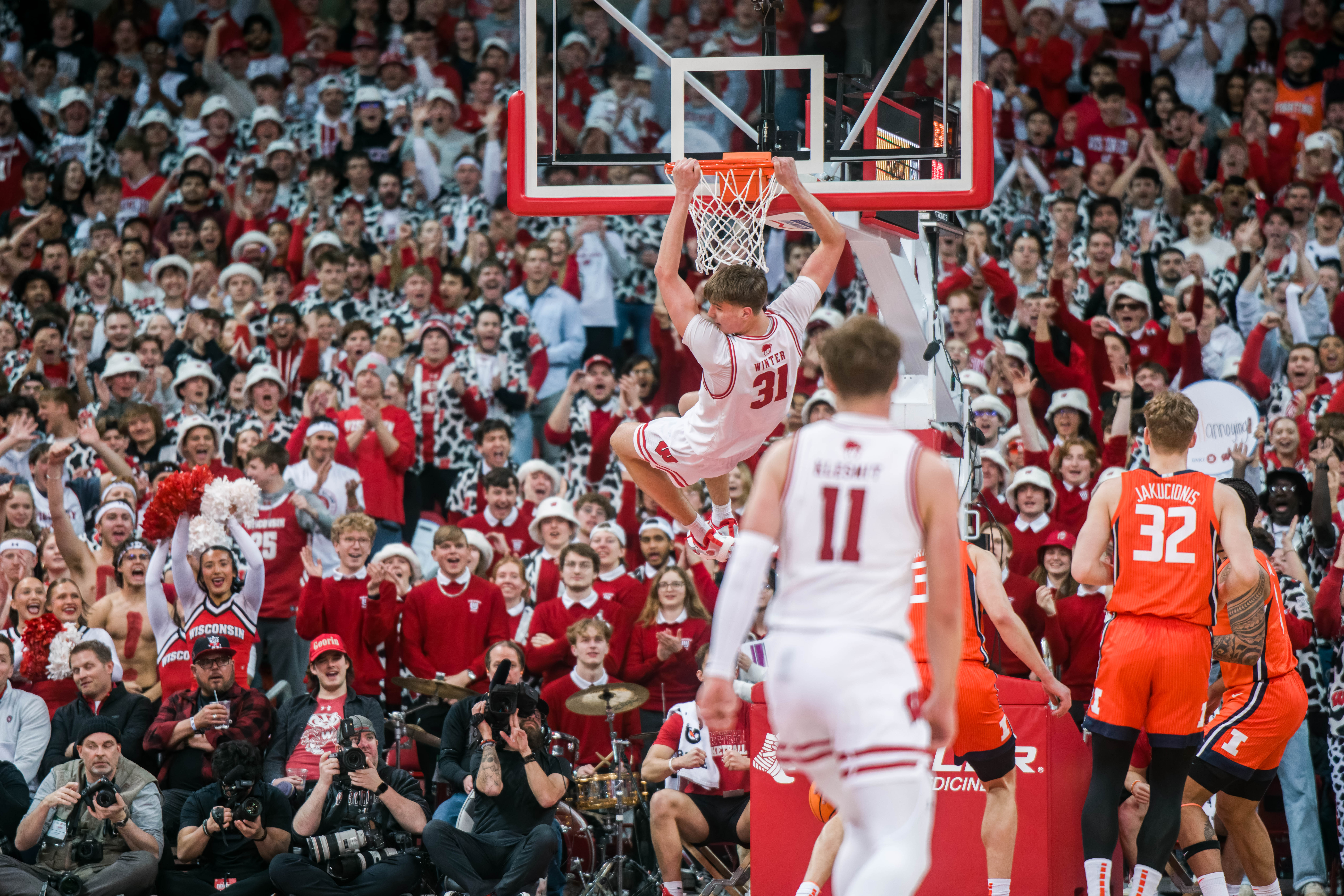 Wisconsin Badgers forward Nolan Winter #31 slams an easy dunk against the Illinois Fighting Illini at The Kohl Center on February 18, 2025 in Madison, Wisconsin. Photography by Ross Harried for Second Crop Sports.