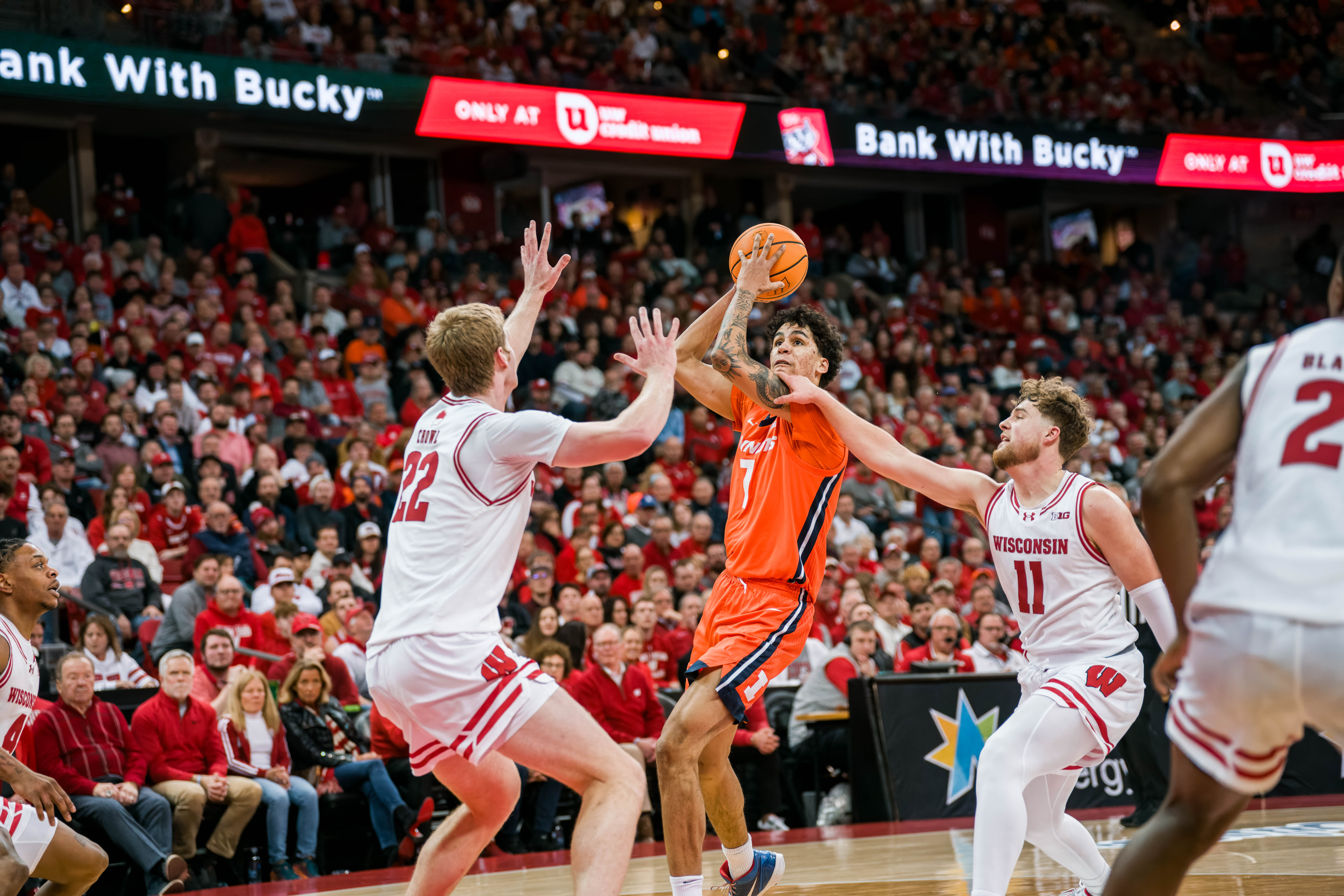 Illinois Fighting Illini forward Will Riley #7 is fouled by Wisconsin Badgers guard Max Klesmit #11 at The Kohl Center on February 18, 2025 in Madison, Wisconsin. Photography by Ross Harried for Second Crop Sports.