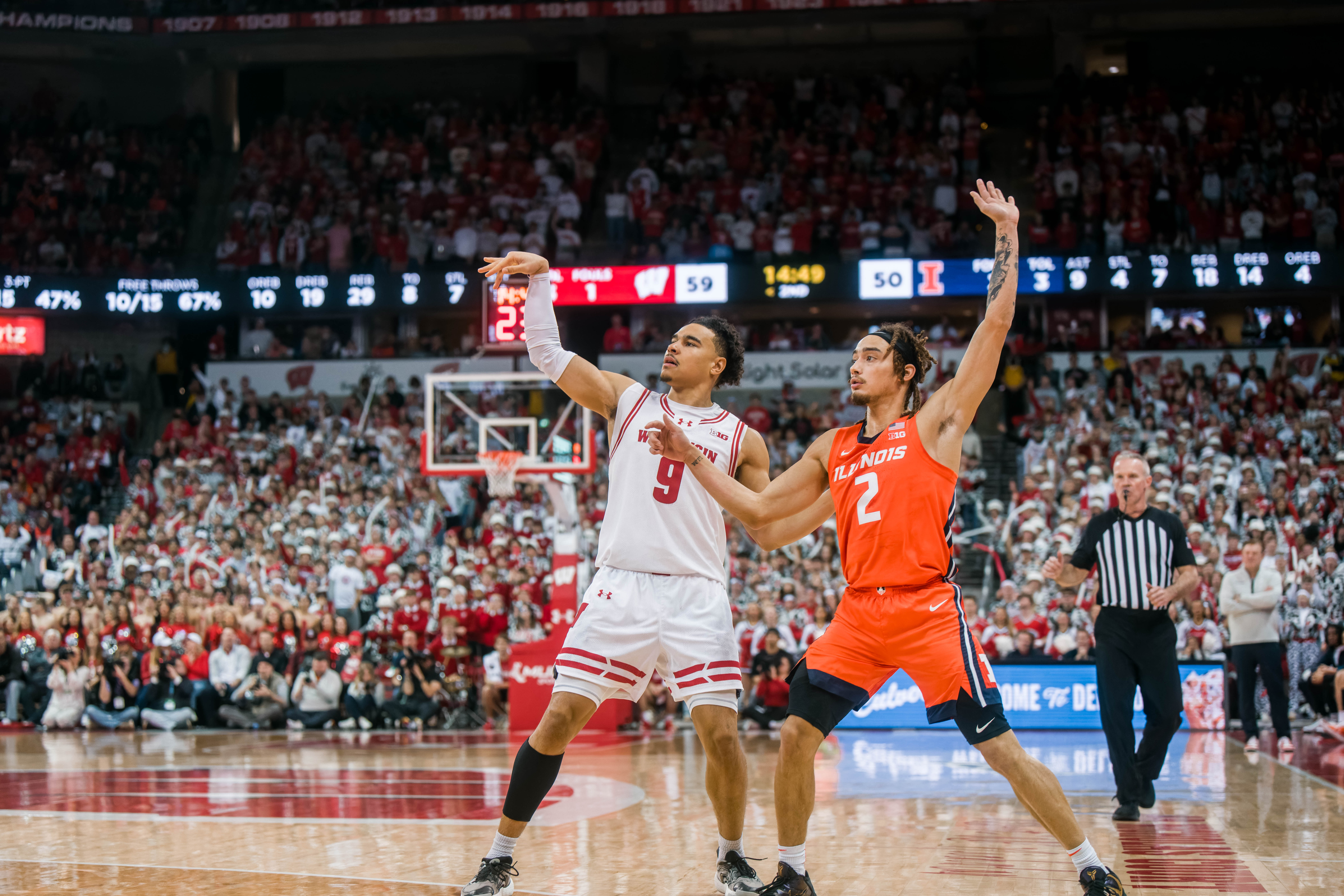 Wisconsin Badgers guard John Tonje #9 attempts a three pointer while defended by Illinois Fighting Illini guard Dra Gibbs-Lawhorn #2 at The Kohl Center on February 18, 2025 in Madison, Wisconsin. Photography by Ross Harried for Second Crop Sports.