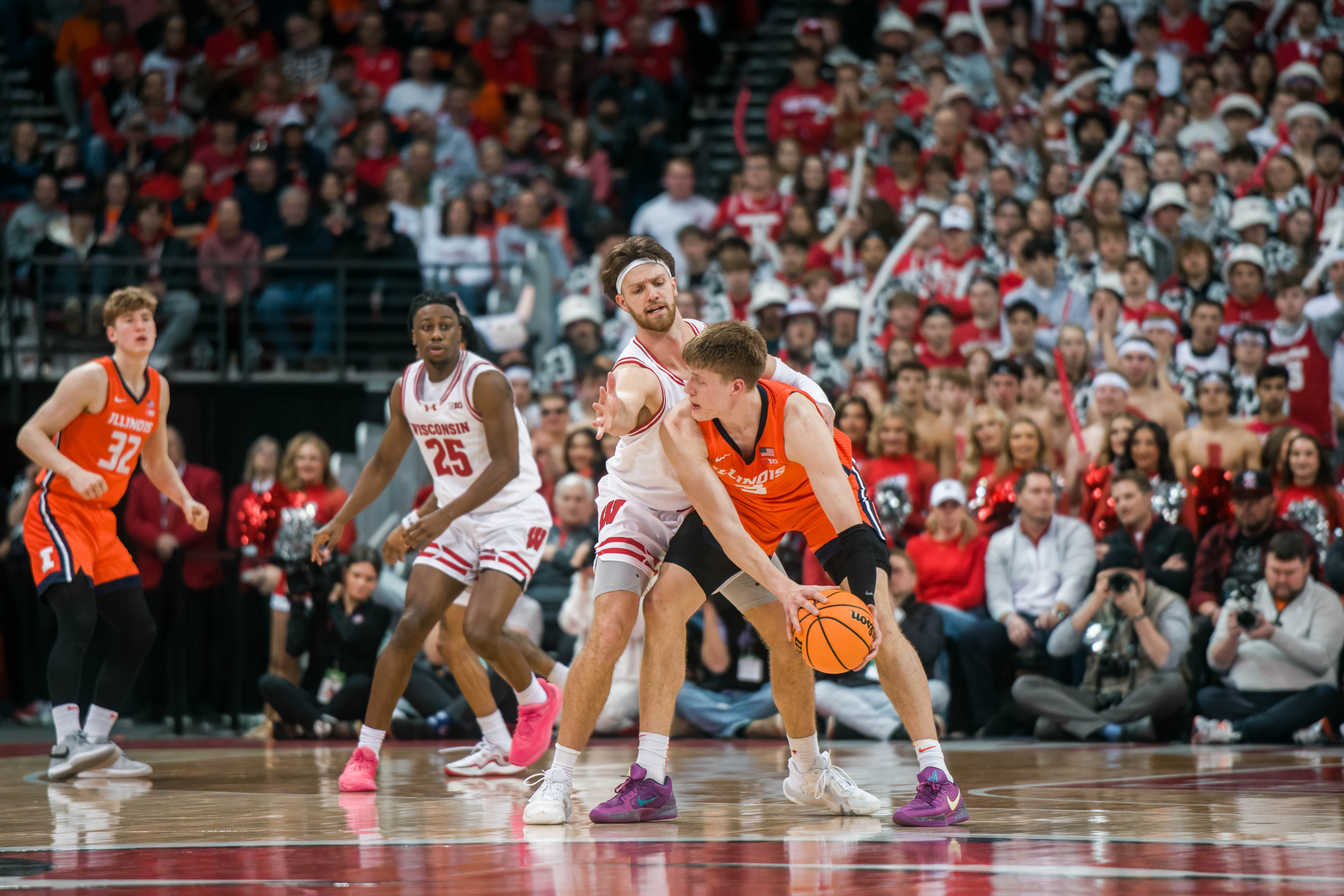 Wisconsin Badgers forward Carter Gilmore #7 blocks the view of Illinois Fighting Illini forward Ben Humrichous #3 at The Kohl Center on February 18, 2025 in Madison, Wisconsin. Photography by Ross Harried for Second Crop Sports.