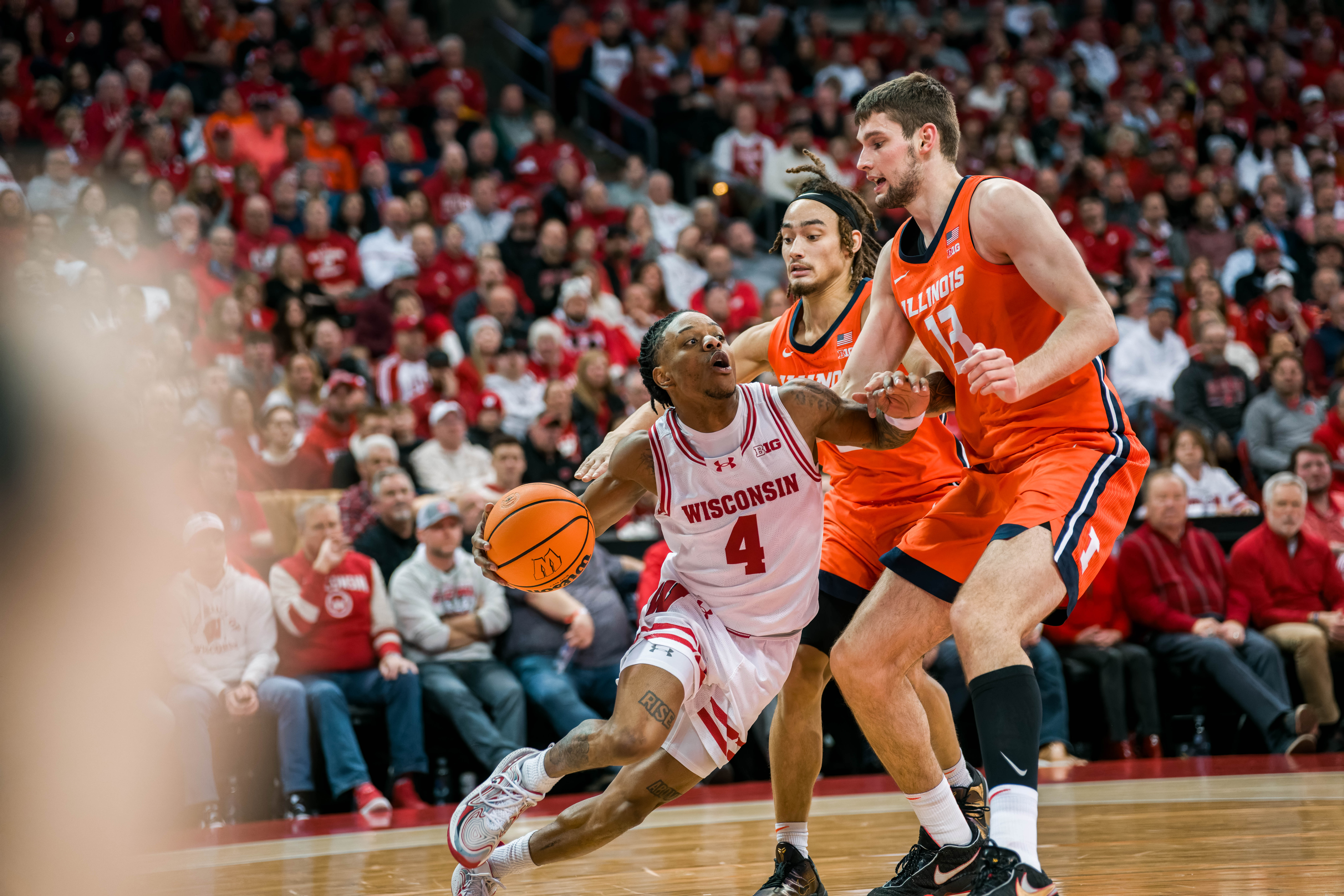 Wisconsin Badgers guard Kamari McGee #4 drive the baseline against the Illinois Fighting Illini at The Kohl Center on February 18, 2025 in Madison, Wisconsin. Photography by Ross Harried for Second Crop Sports.