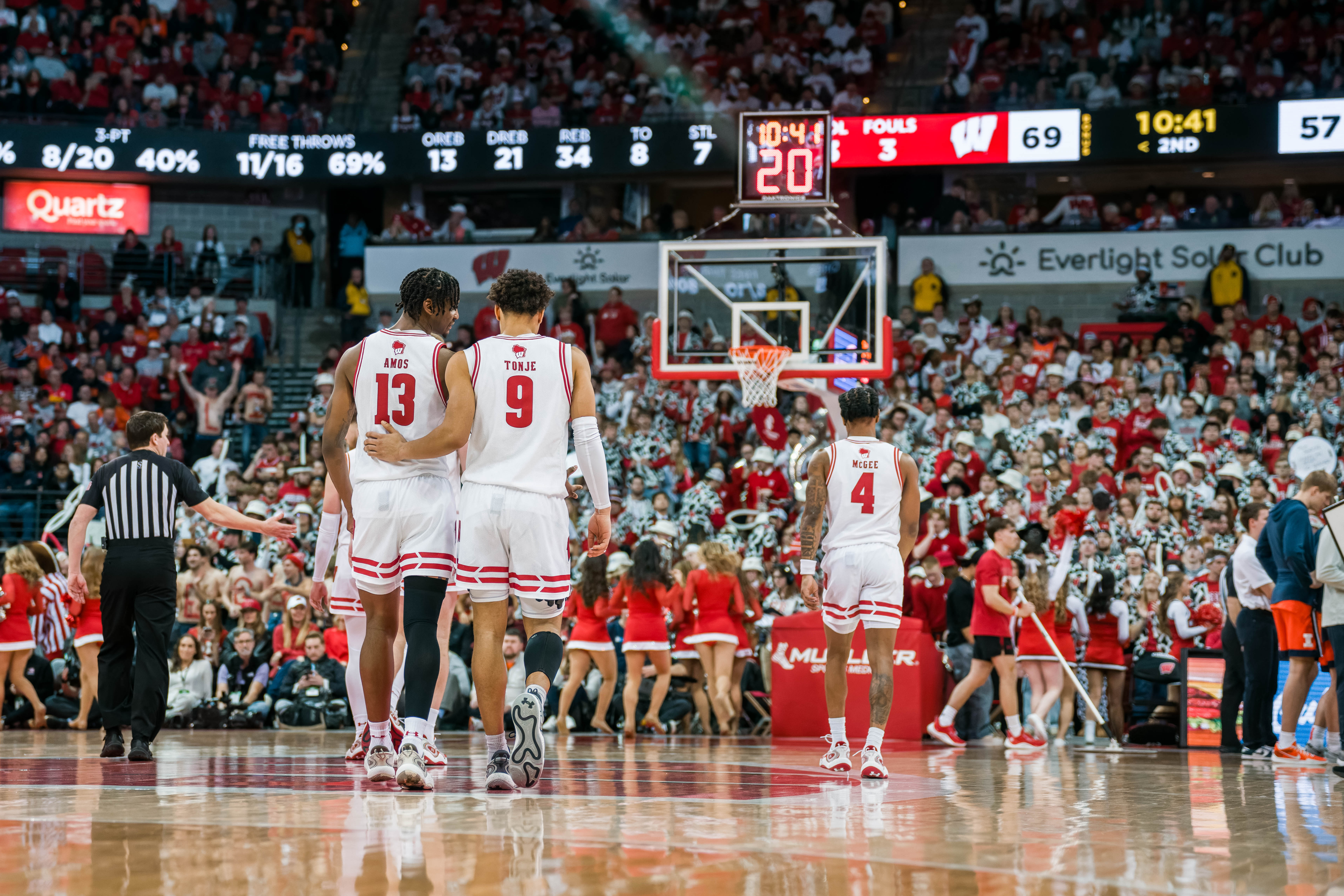 Wisconsin Badgers guard John Tonje #9 talks things over with Wisconsin Badgers forward Xavier Amos #13 against the Illinois Fighting Illini at The Kohl Center on February 18, 2025 in Madison, Wisconsin. Photography by Ross Harried for Second Crop Sports.