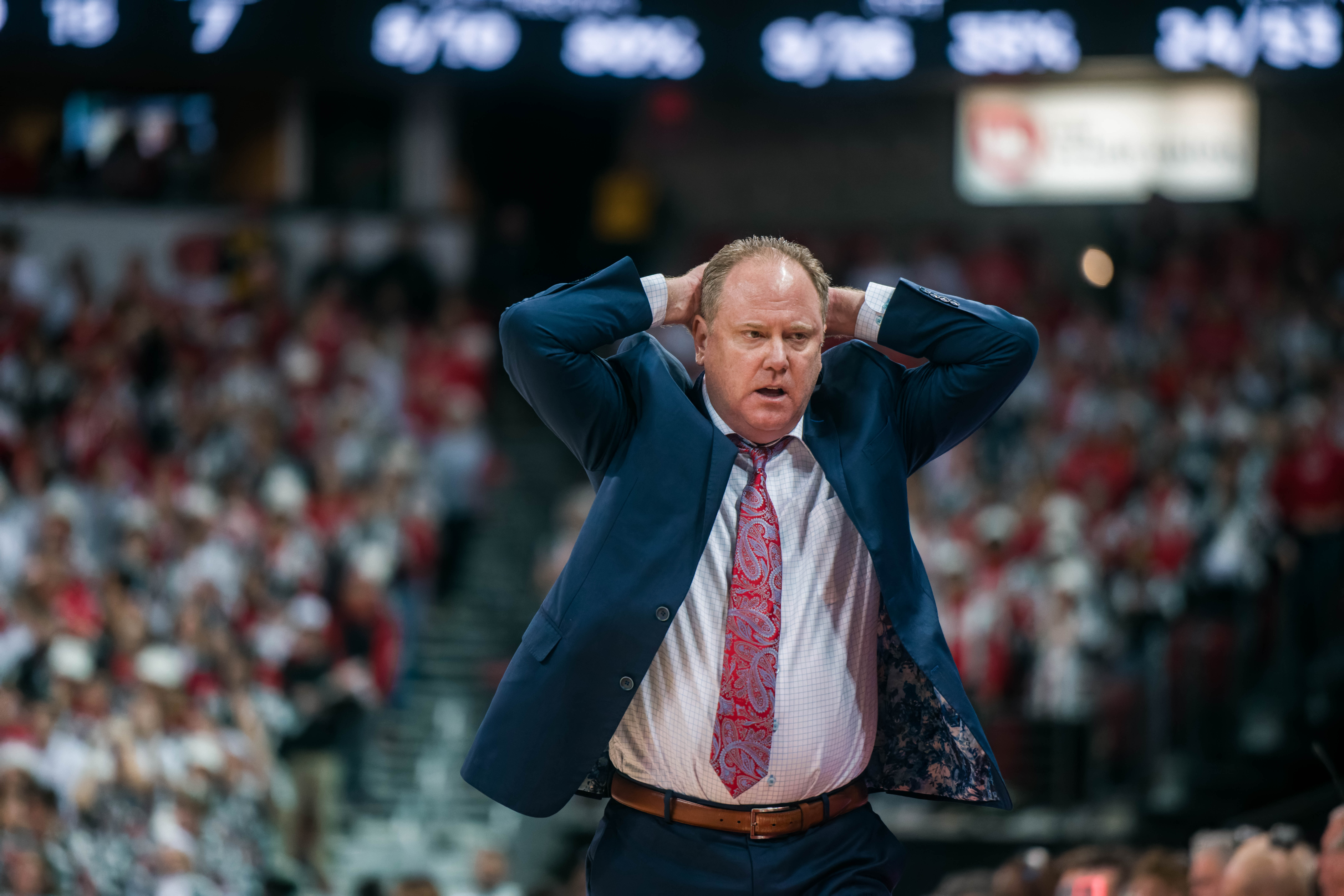 Wisconsin Badgers Head Coach Greg Gard in disbelief after a foul is committed by his team against the Illinois Fighting Illini at The Kohl Center on February 18, 2025 in Madison, Wisconsin. Photography by Ross Harried for Second Crop Sports.