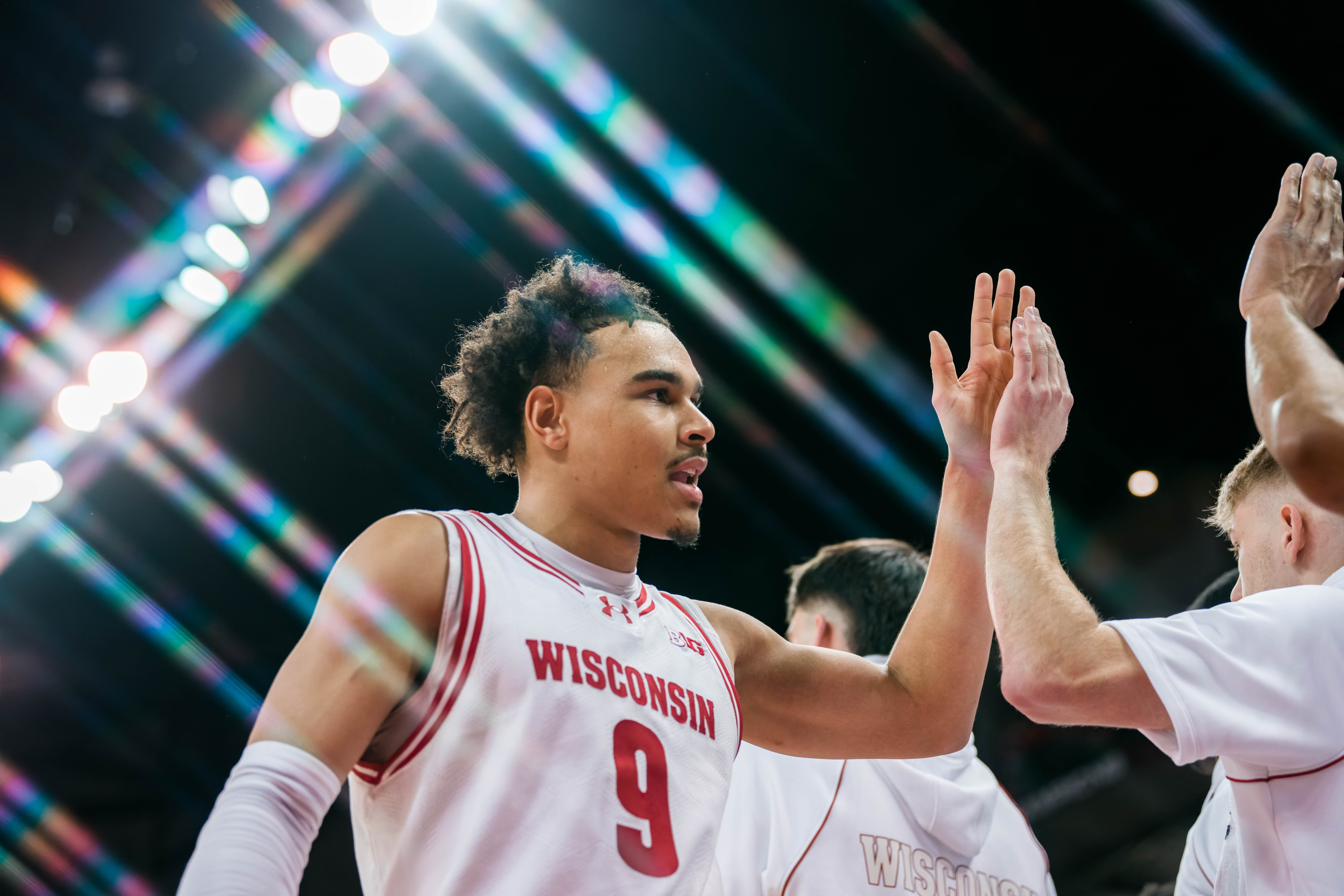 Wisconsin Badgers guard John Tonje #9 heads to the bench against the Illinois Fighting Illini at The Kohl Center on February 18, 2025 in Madison, Wisconsin. Photography by Ross Harried for Second Crop Sports.