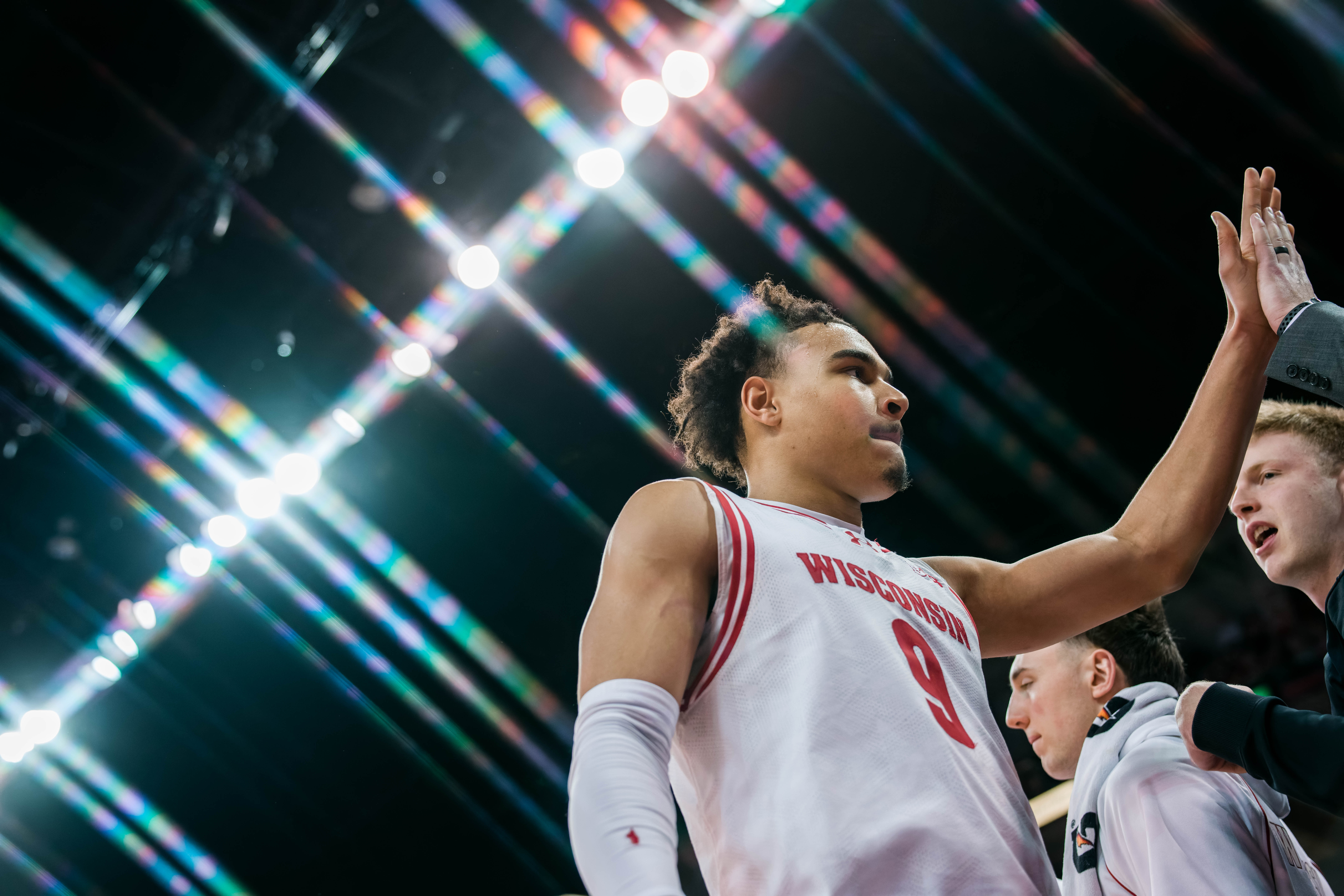 Wisconsin Badgers guard John Tonje #9 heads to the bench against the Illinois Fighting Illini at The Kohl Center on February 18, 2025 in Madison, Wisconsin. Photography by Ross Harried for Second Crop Sports.