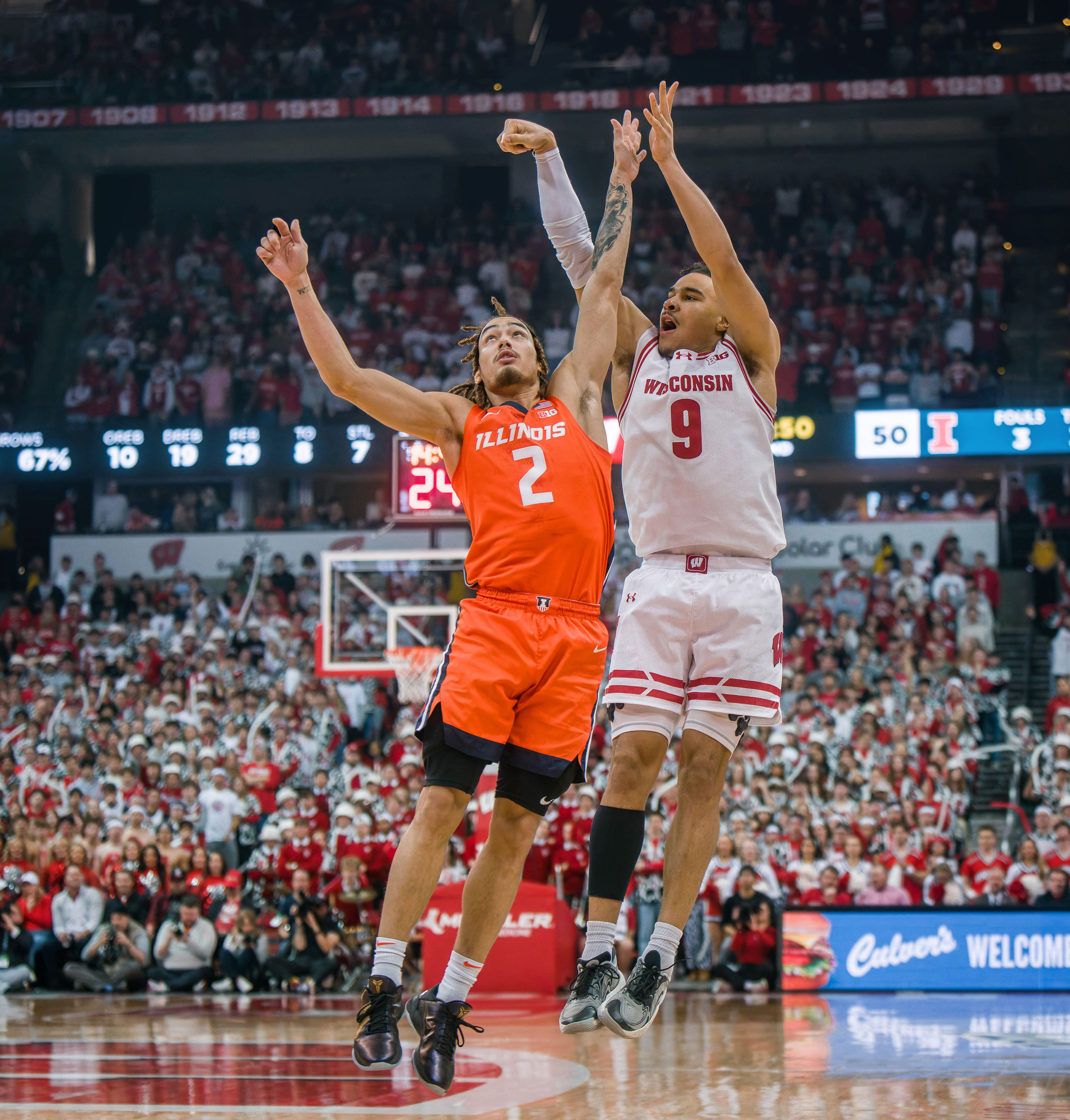 Wisconsin Badgers guard John Tonje #9 attempts a three pointer over Illinois Fighting Illini guard Dra Gibbs-Lawhorn #2 at The Kohl Center on February 18, 2025 in Madison, Wisconsin. Photography by Ross Harried for Second Crop Sports.