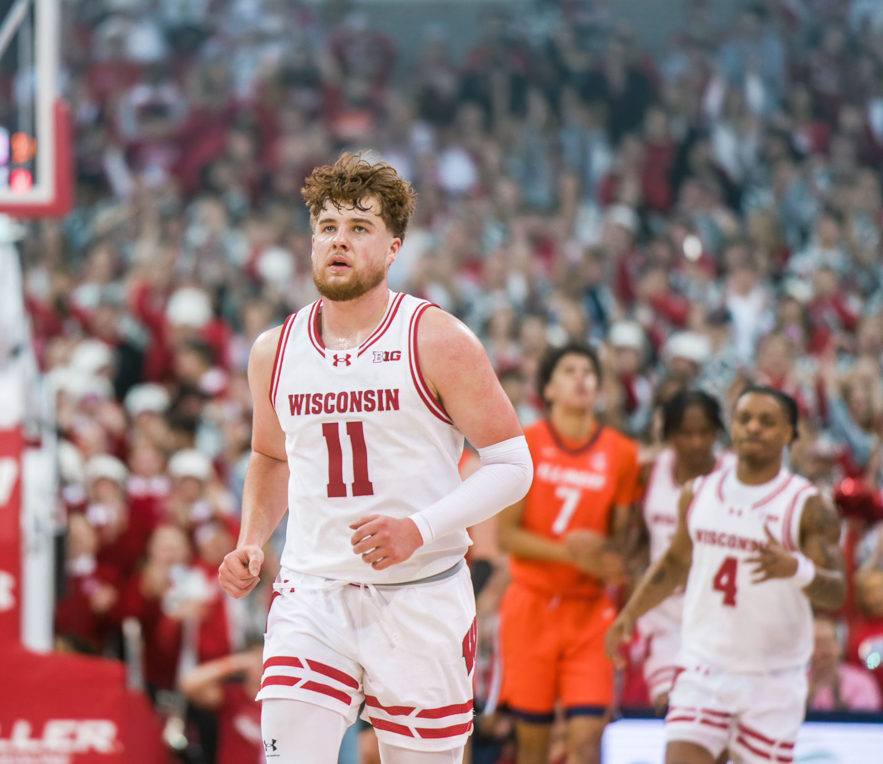 Wisconsin Badgers guard Max Klesmit #11 falls back on defense after draining a three pointer against the Illinois Fighting Illini at The Kohl Center on February 18, 2025 in Madison, Wisconsin. Photography by Ross Harried for Second Crop Sports.